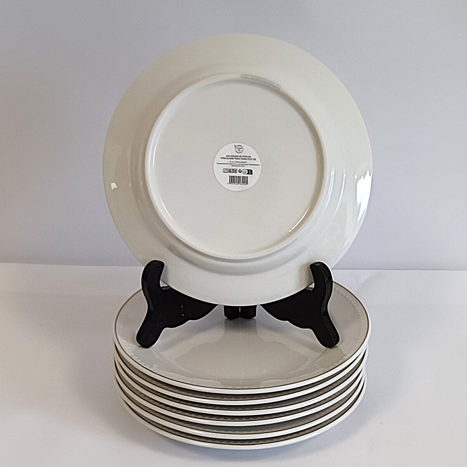 Voir photo 2 de 7 assiettes à dessert en porcelaine Ø 19 cm avec filet doré 7 assiettes à dessert en porcelaine Ø 19 cm avec filet doré reconditionné photo 2