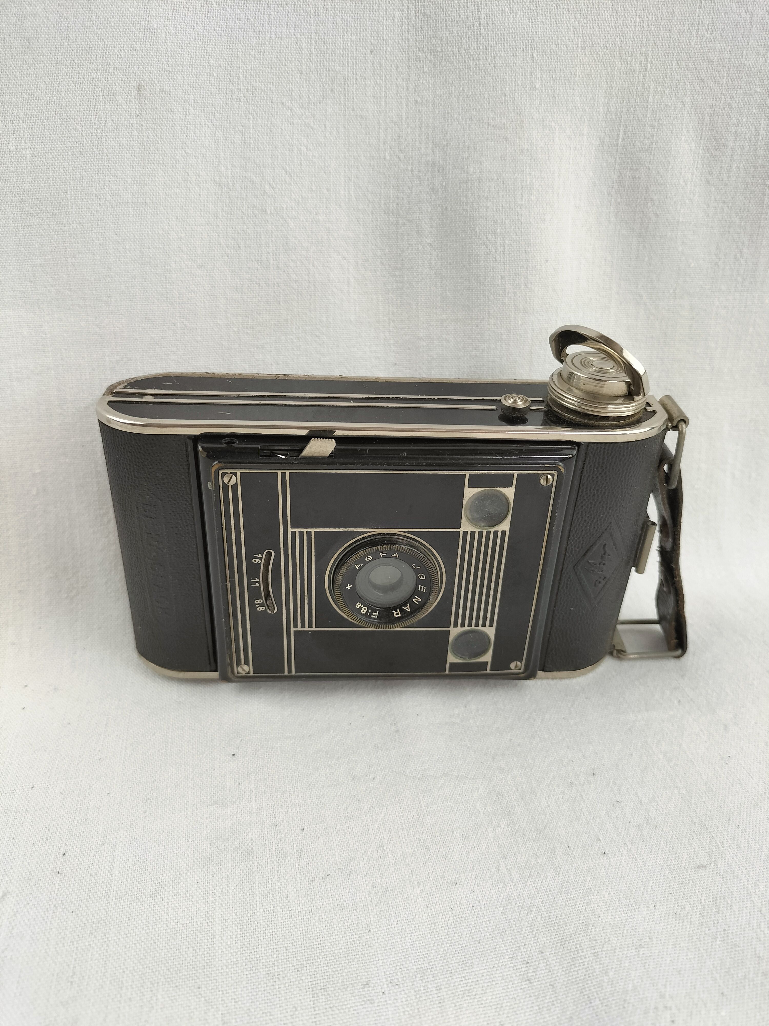 Voir photo 27 de Appareil photo ancien AGFA à soufflet avec étui d'origine – Charme vintage des années 1930-1950 Appareil photo ancien AGFA à soufflet avec étui d'origine – Charme vintage des années 1930-1950 bon état reconditionné photo 27