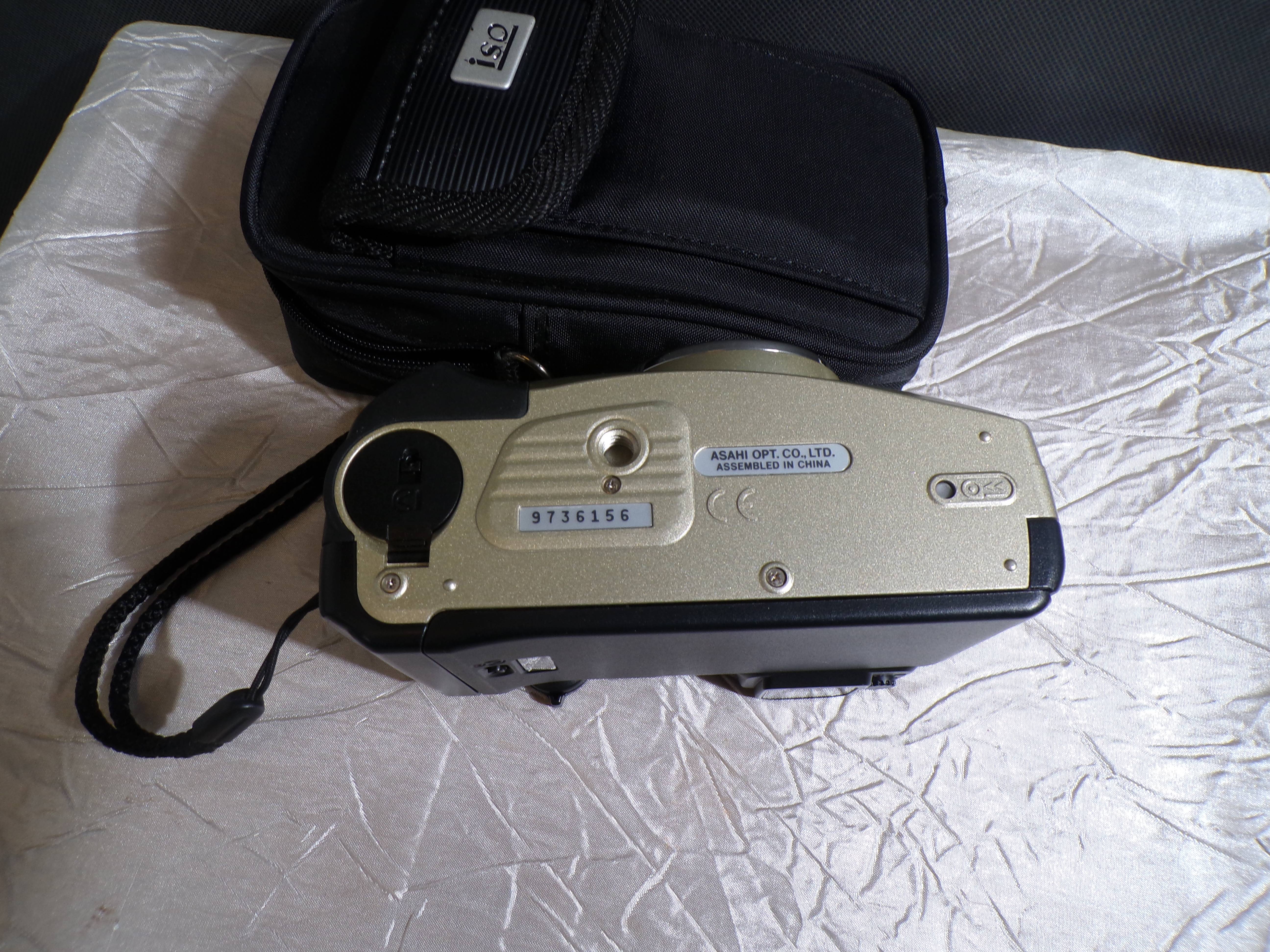 Voir photo 3 de Appareil photo argentique compact Pentax Espio 105G (vendu avec sa housse de protection et sa dragonne). Appareil photo argentique compact Pentax Espio 105G (vendu avec sa housse de protection et sa dragonne). Bon état reconditionné photo 3