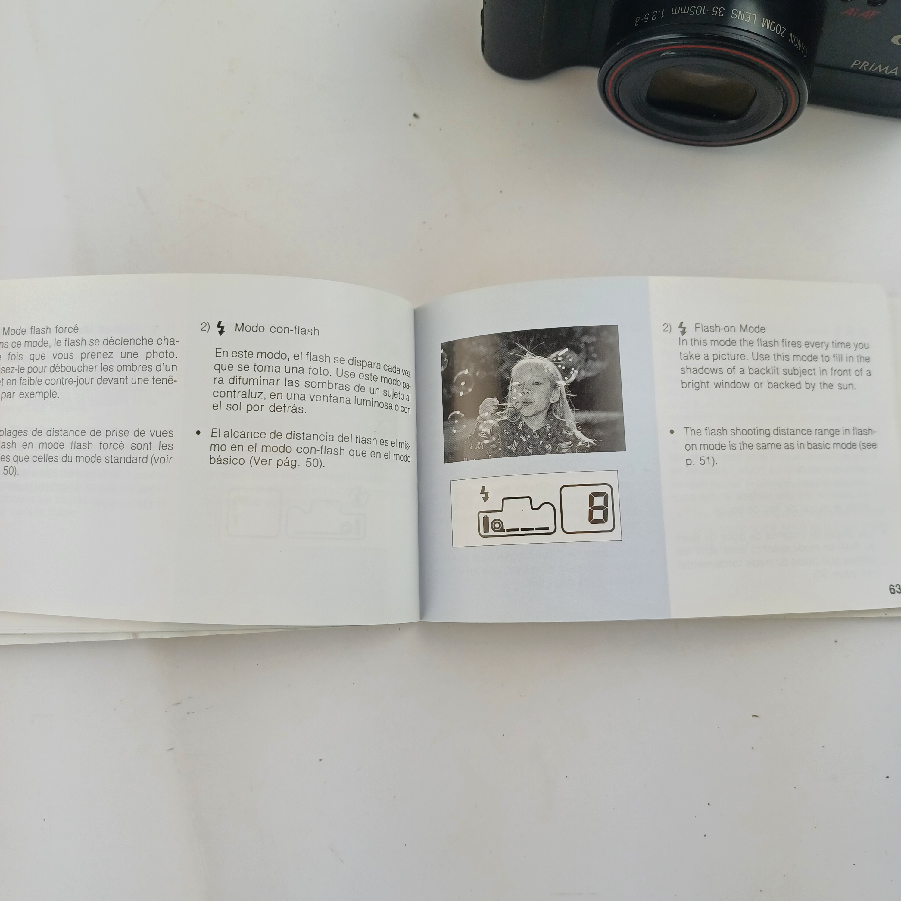 Voir photo 11 de Appareil photo Canon Prima 105 avec batterie lithium KL2CR5 sans chargeur, pellicule dedans, zoom 35-105, flash intégré, mode yeux rouges, retardateur et rafale, avec pochette et mode d'emploi Appareil photo Canon Prima 105 avec batterie lithium KL2CR5 sans chargeur, pellicule dedans, zoom 35-105, flash intégré, mode yeux rouges, retardateur et rafale, avec pochette et mode d'emploi Très bon état reconditionné photo 11