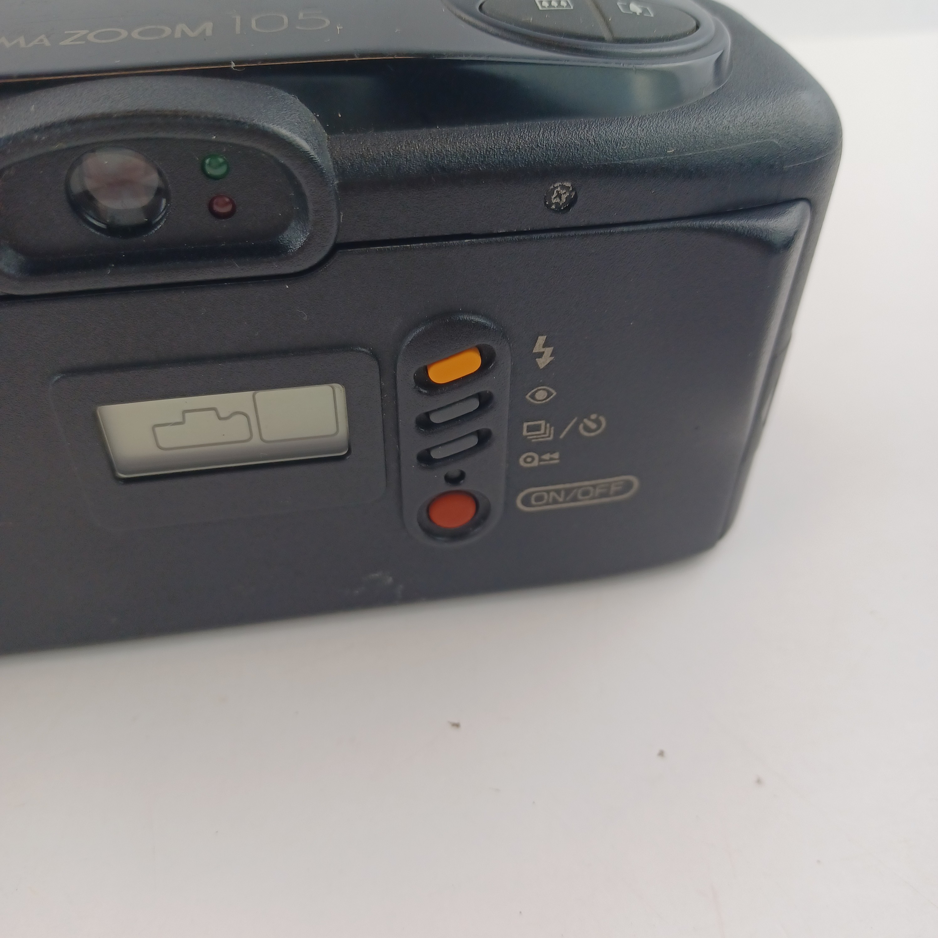 Voir photo 7 de Appareil photo Canon Prima 105 avec batterie lithium KL2CR5 sans chargeur, pellicule dedans, zoom 35-105, flash intégré, mode yeux rouges, retardateur et rafale, avec pochette et mode d'emploi Appareil photo Canon Prima 105 avec batterie lithium KL2CR5 sans chargeur, pellicule dedans, zoom 35-105, flash intégré, mode yeux rouges, retardateur et rafale, avec pochette et mode d'emploi Très bon état reconditionné photo 7