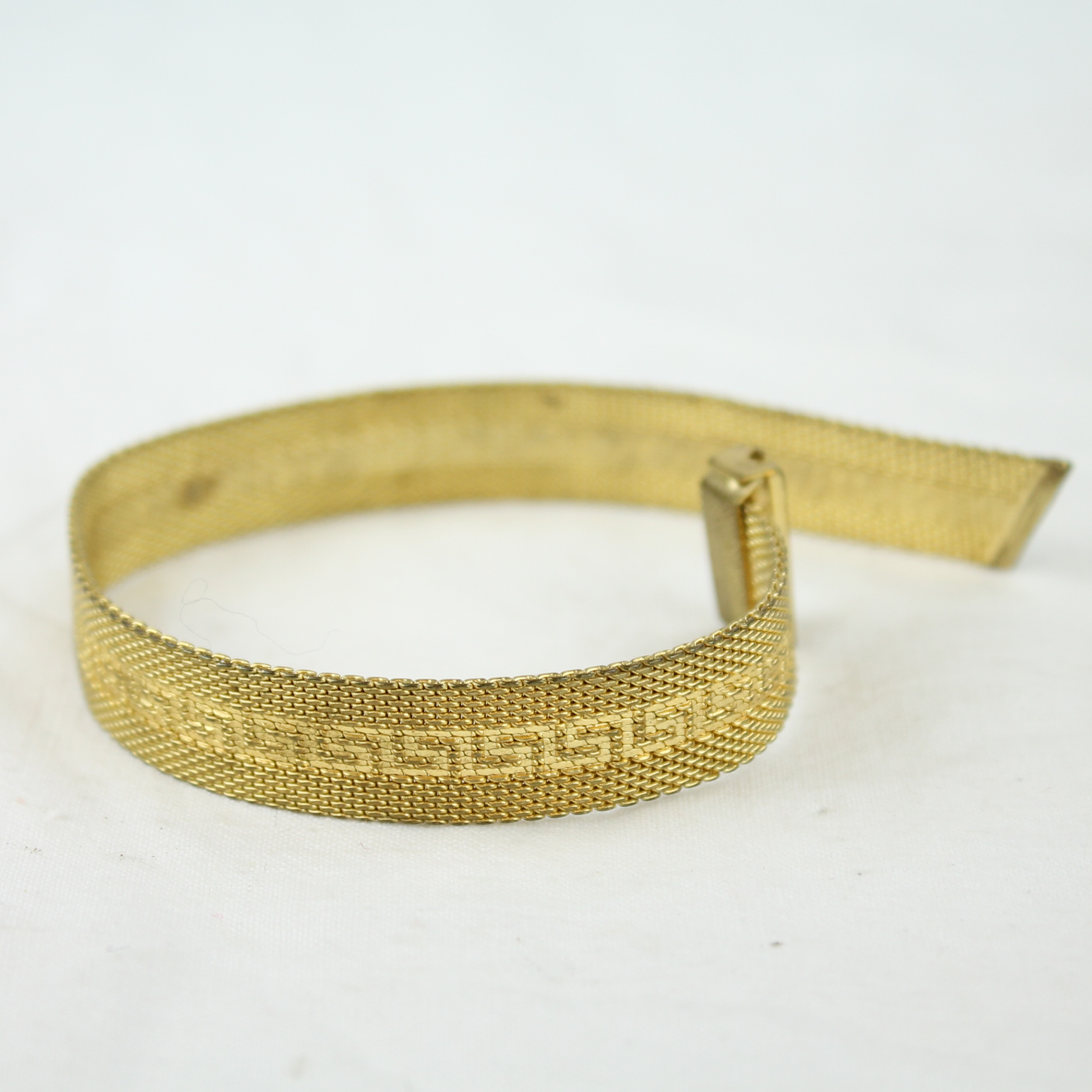 Voir photo 2 de Bracelet "Clé de Méandre" - Métal doré Bracelet "Clé de Méandre" - Métal doré Très bon état reconditionné photo 2