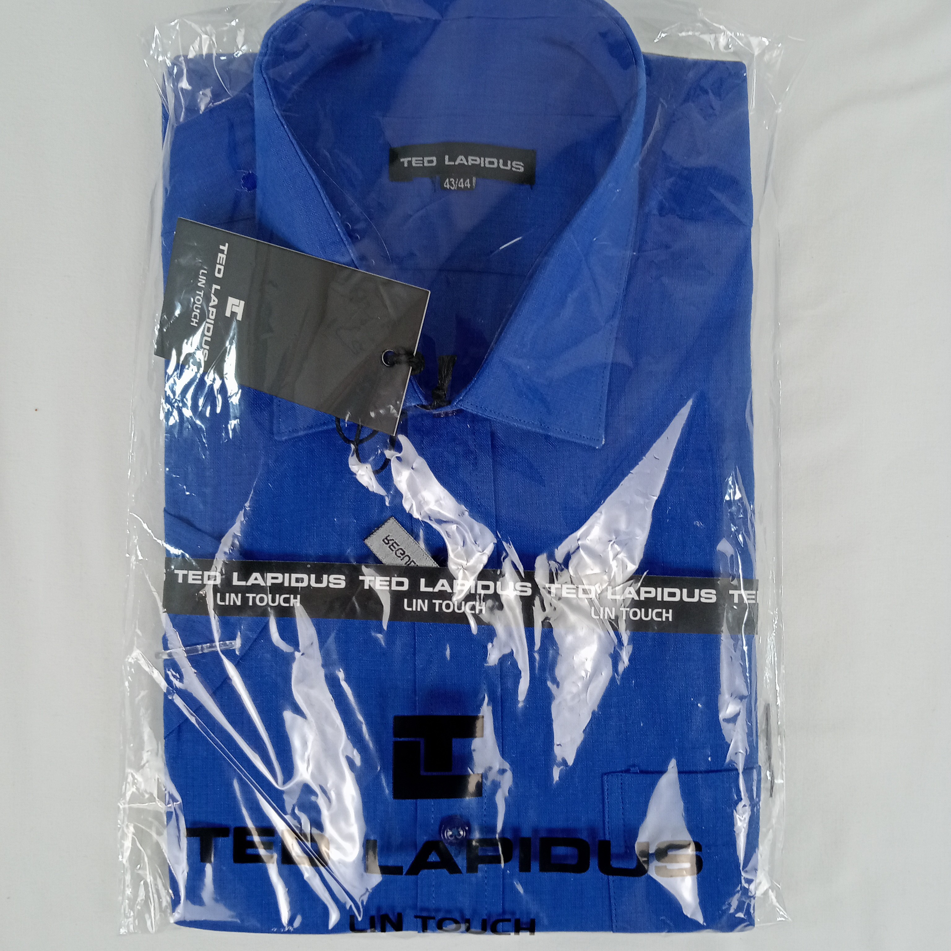 Voir photo 2 de Chemise homme de la marque Ted Lapidus manches courtes de couleur bleu taille XL (44) Chemise homme de la marque Ted Lapidus manches courtes de couleur bleu taille XL (44) Parfait état reconditionné photo 2