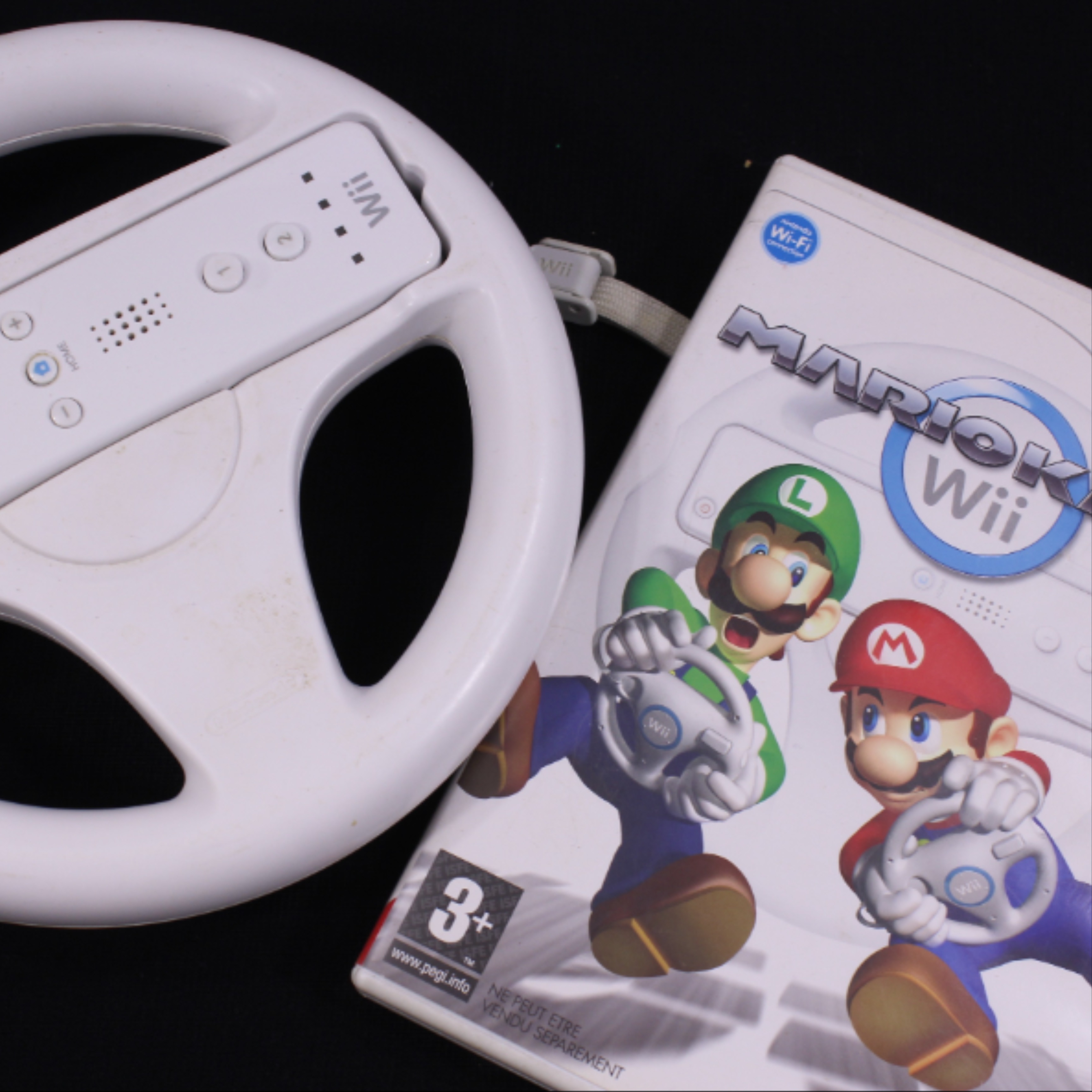 Voir photo 2 de Console WII + volant et jeu Mario Kart - Nintendo Console WII + volant et jeu Mario Kart - Nintendo Bon état reconditionné photo 2