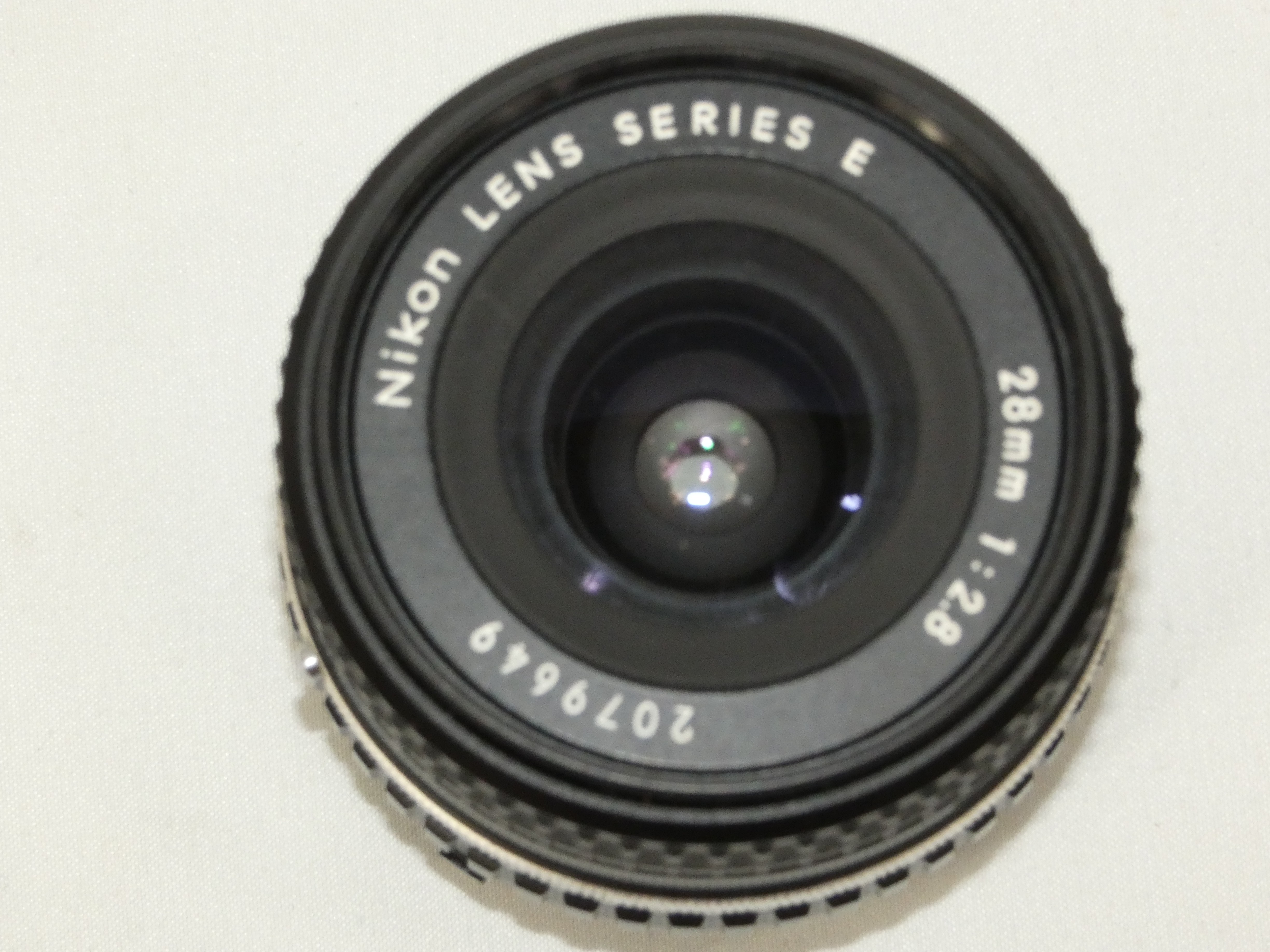 Voir photo 10 de Ensemble appareil photo argentique NIKON EM avec 2 objectifs 28 mm 1:2.8 et 50 mm 1:1.8 et un flash Hanimex tx30 (Non testé) Ensemble appareil photo argentique NIKON EM avec 2 objectifs 28 mm 1:2.8 et 50 mm 1:1.8 et un flash Hanimex tx30 (Non testé) Très bon état reconditionné photo 10