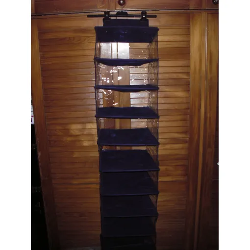 Etagère suspendue de rangement  à chaussures d'armoire en PVC et tissu bleu ,10 compartiments ,,accroche Scratch ,dimensions :hauteur 135 cm ,largeur 28cm ,profondeur 29 cm . Bon état reconditionné disponible sur Rakuten