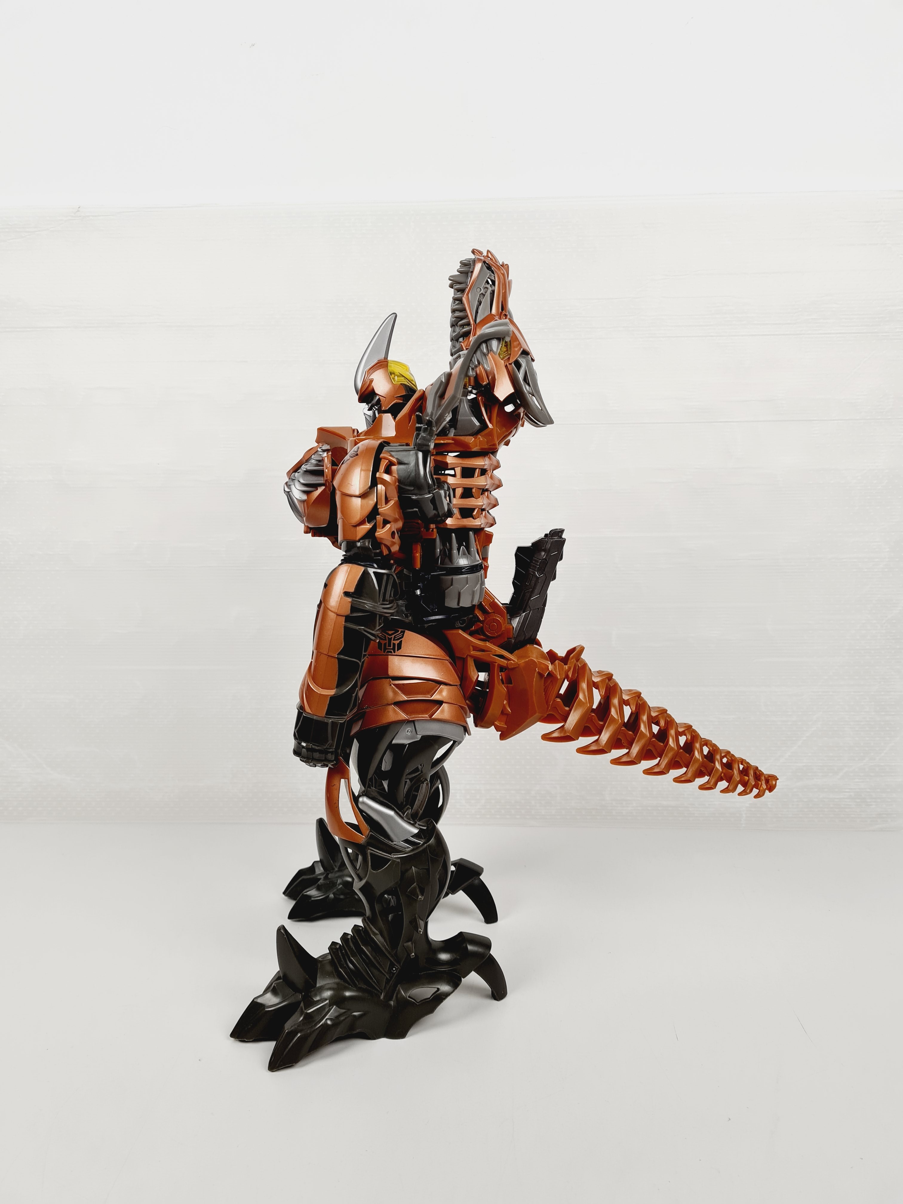 Voir photo 3 de Figurine - Transformers dinosaure Grimlock - 50 cm Figurine - Transformers dinosaure Grimlock - 50 cm Bon état reconditionné photo 3
