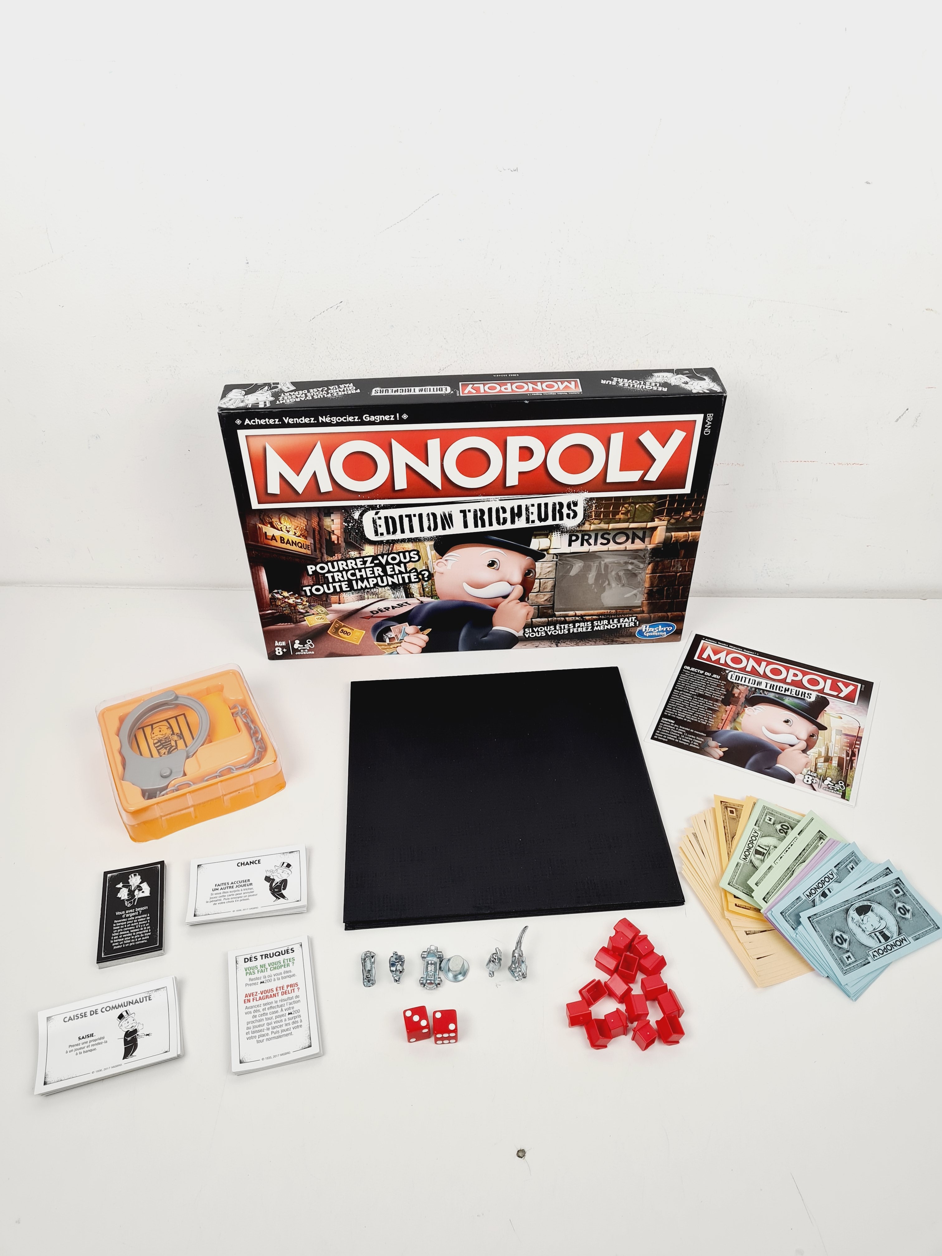 Voir photo 3 de Jeu de gestion de ressources - Monopoly - Éditions tricheurs - Hasbro - Dès 8 ans Jeu de gestion de ressources - Monopoly - Éditions tricheurs - Hasbro - Dès 8 ans Bon état reconditionné photo 3