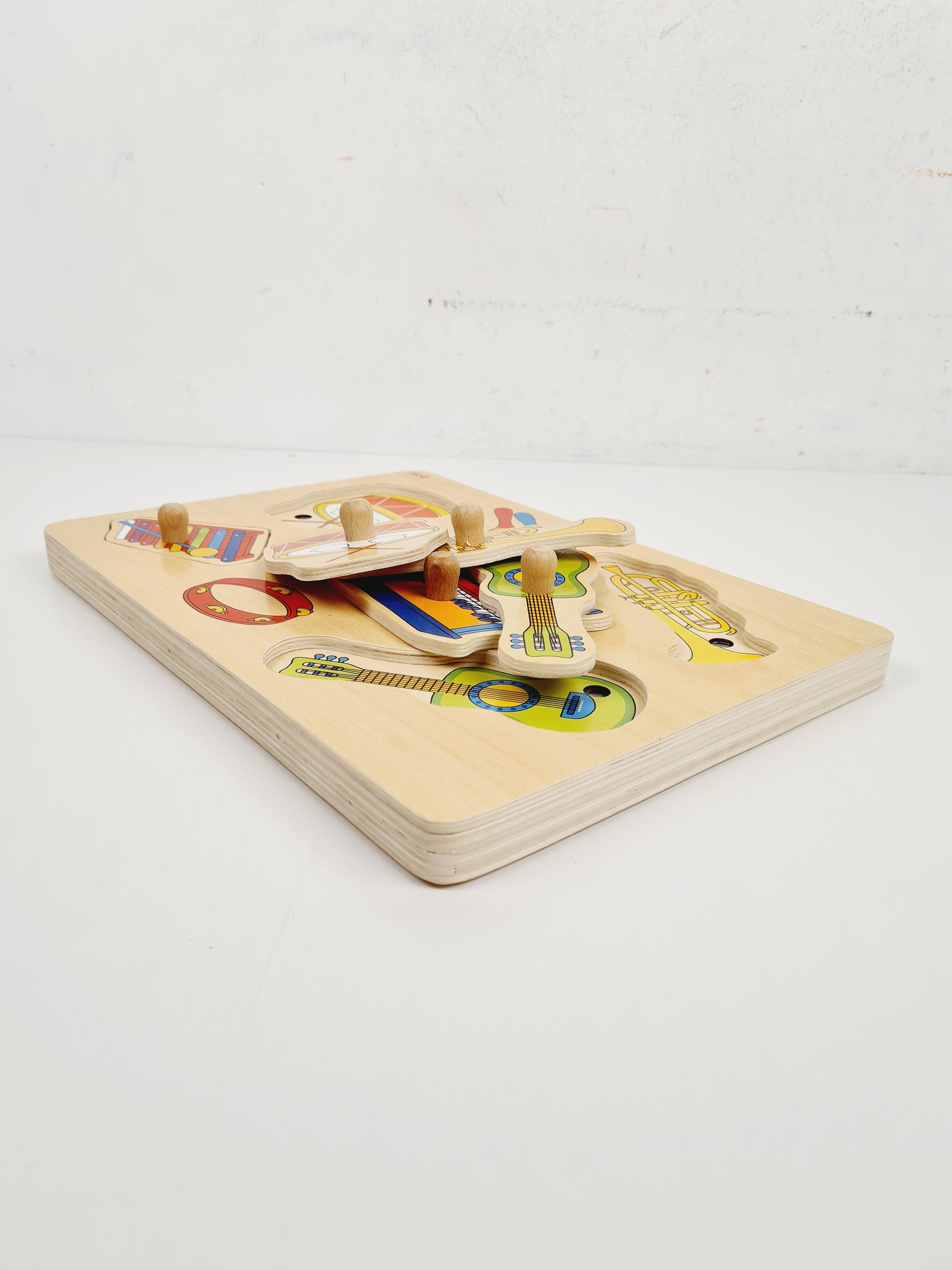 Voir photo 2 de Jouet en bois - Puzzle sonores instruments de musique - Goki - 3 ans + Jouet en bois - Puzzle sonores instruments de musique - Goki - 3 ans + Bon état reconditionné photo 2