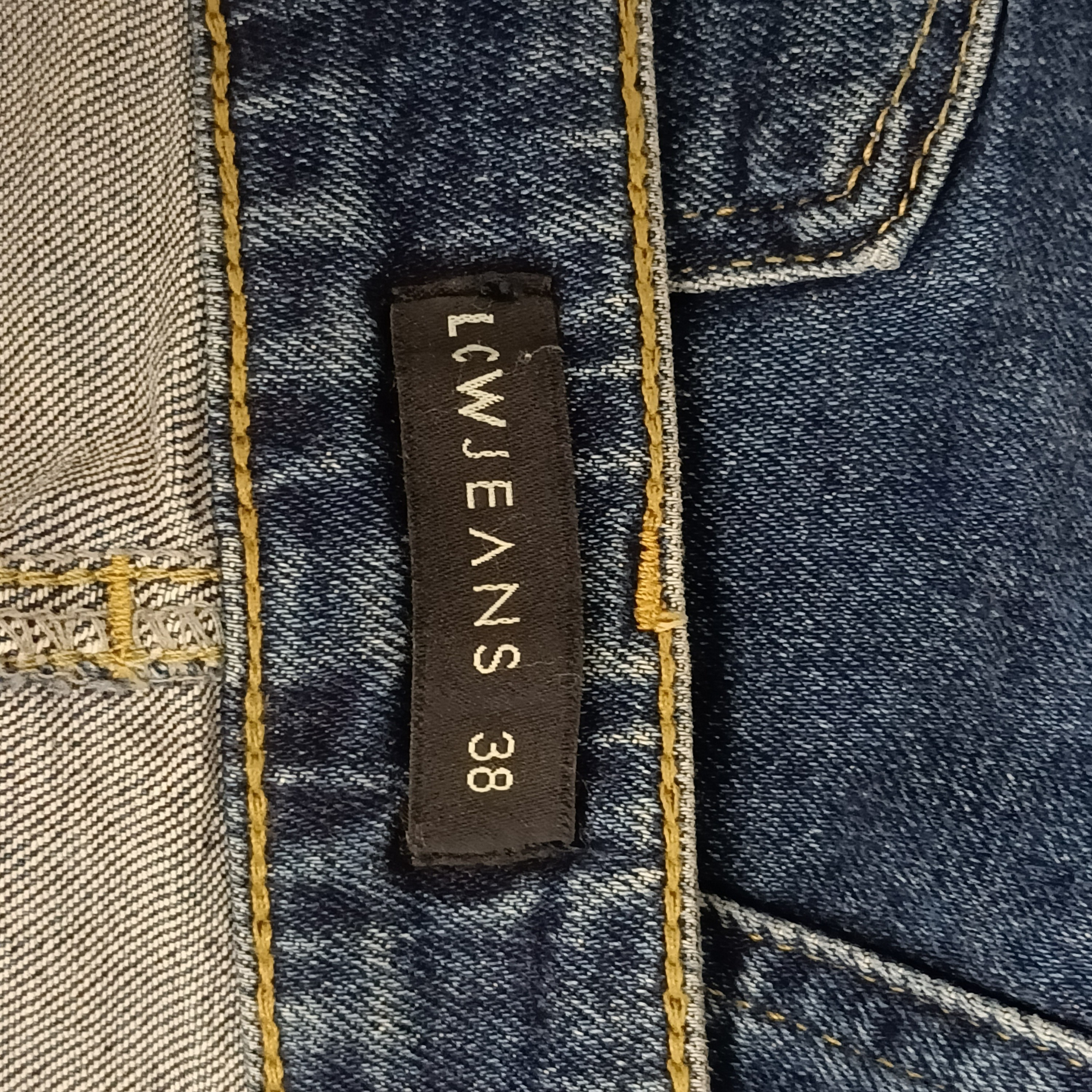 Voir photo 3 de Jupe midi en jean bleu T.W.EANS coupe droite fendue taille 38 Jupe midi en jean bleu T.W.EANS coupe droite fendue taille 38 Très bon état reconditionné photo 3