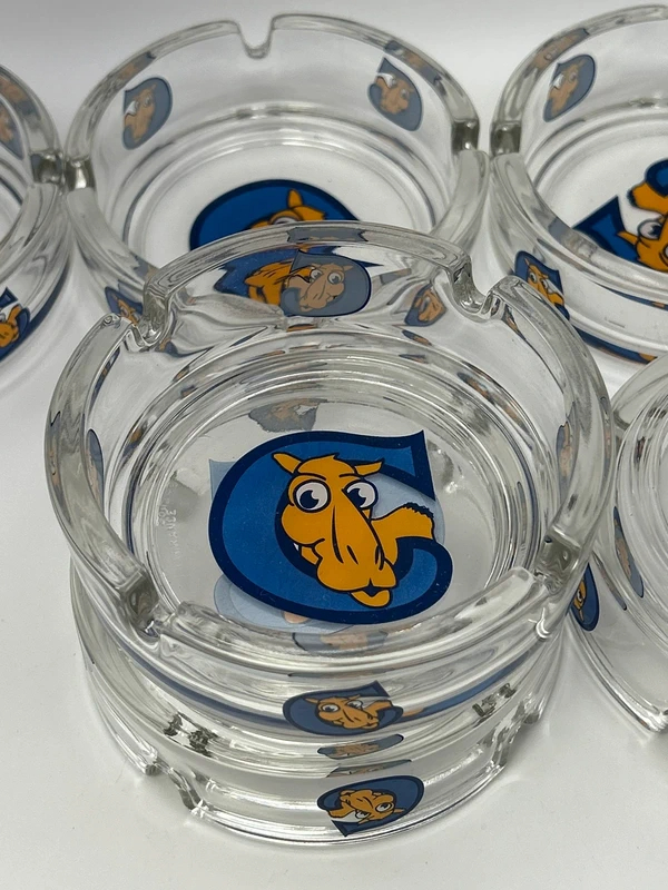 Voir photo 12 de Lot 6 cendriers publicitaires Camel Joe Camel vintage verre collection Lot 6 cendriers publicitaires Camel Joe Camel vintage verre collection Très bon état reconditionné photo 12