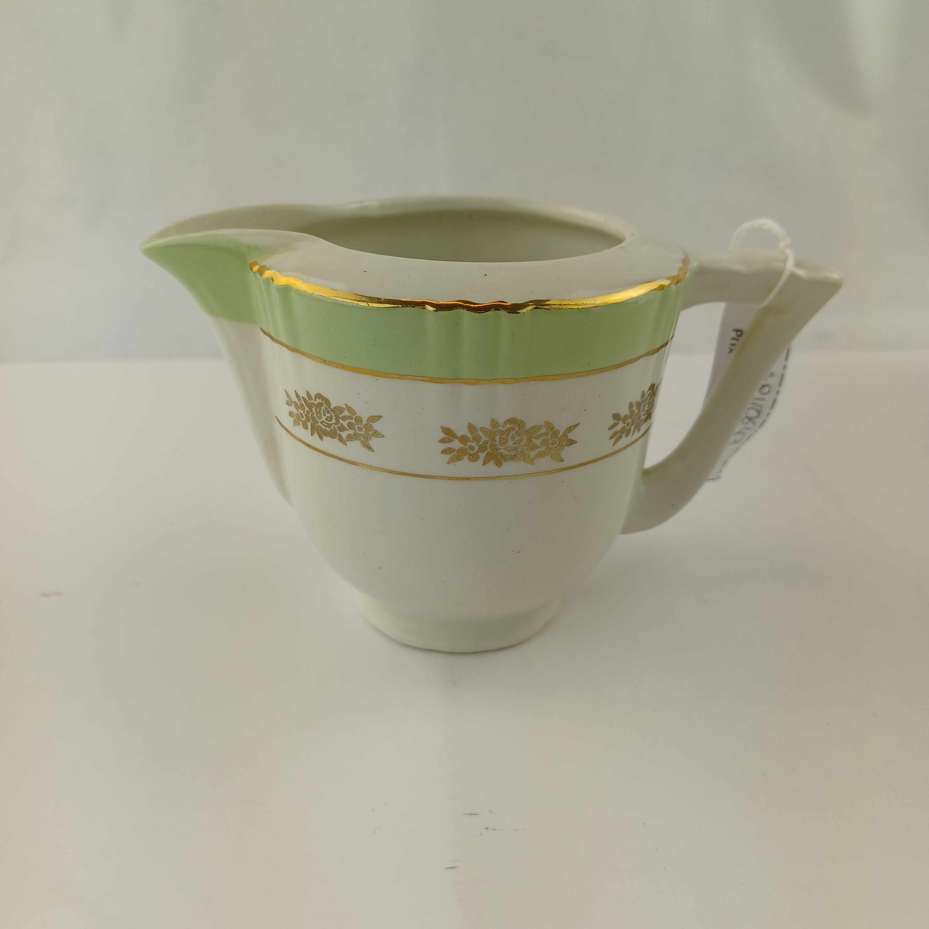 Voir photo 5 de Lot cafetière, sucrier et pot à lait en Porcelaine dorée et vert clair – Eros Faïencerie d’Orchies Lot cafetière, sucrier et pot à lait en Porcelaine dorée et vert clair – Eros Faïencerie d’Orchies Très bon état reconditionné photo 5