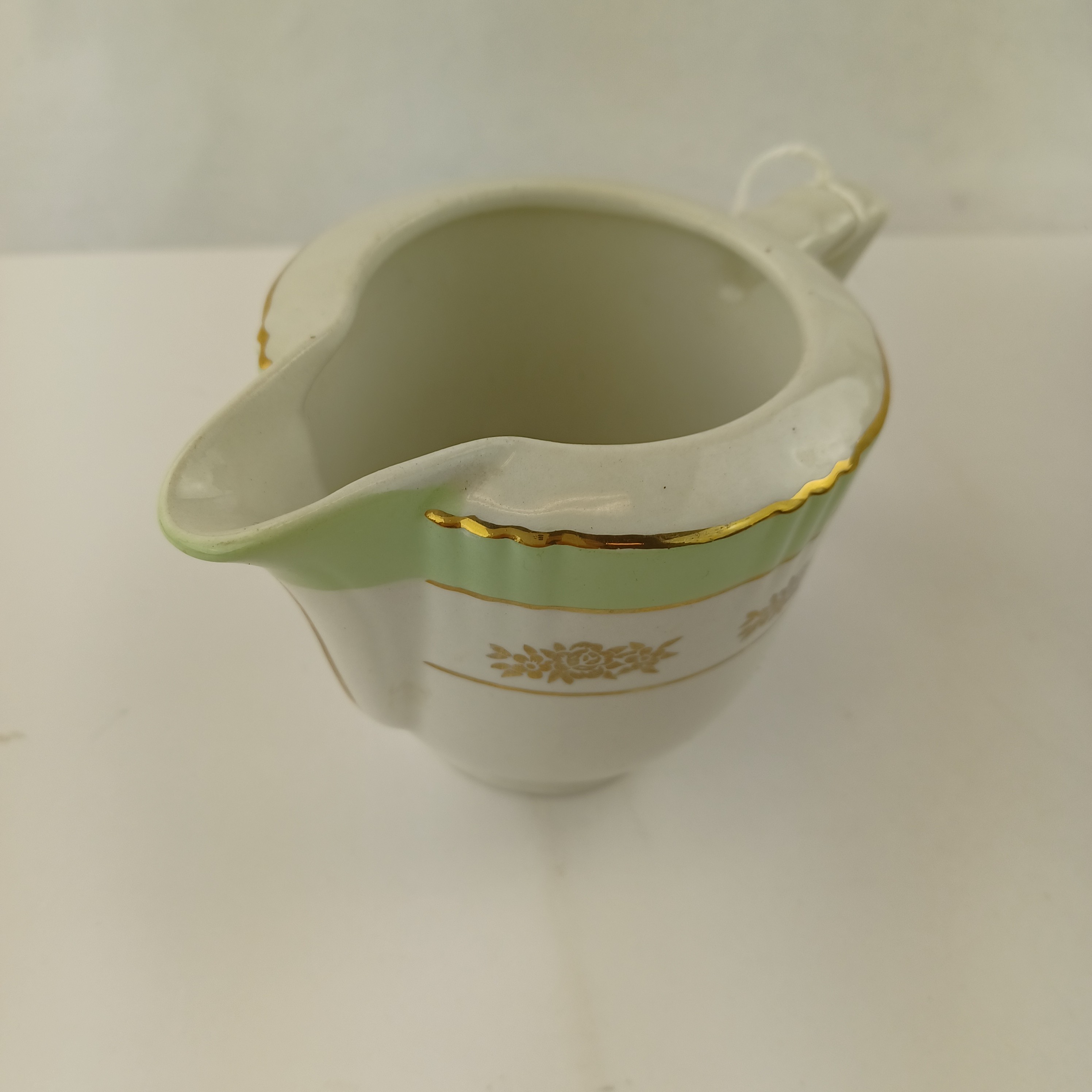 Voir photo 6 de Lot cafetière, sucrier et pot à lait en Porcelaine dorée et vert clair – Eros Faïencerie d’Orchies Lot cafetière, sucrier et pot à lait en Porcelaine dorée et vert clair – Eros Faïencerie d’Orchies Très bon état reconditionné photo 6