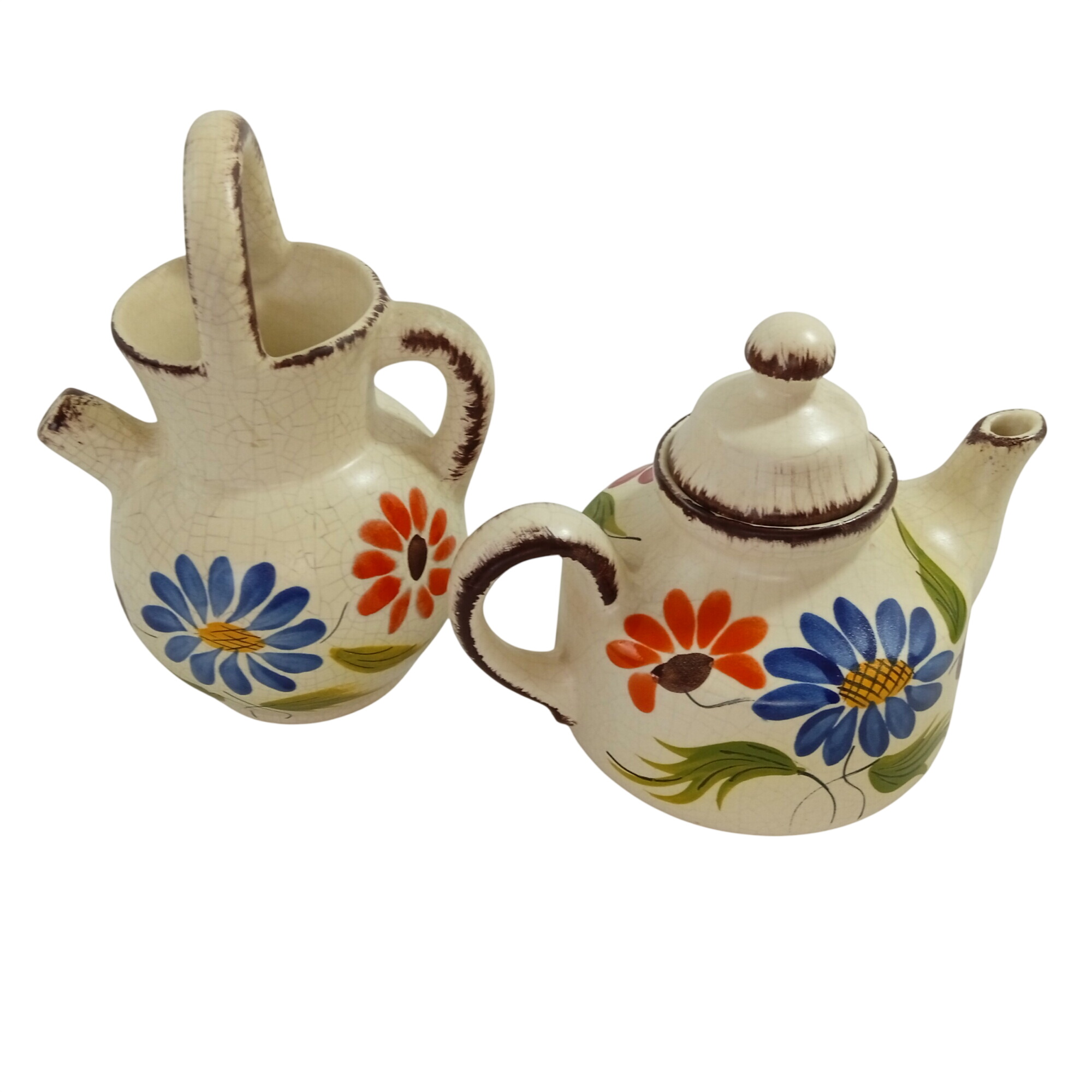 Lot de 2 théière et cruche en poterie décor fait main signée Très bon état - alternatives disponibles sur Dero Lot de 2 théière et cruche en poterie décor fait main signée Très bon état reconditionné (offre indisponible)
