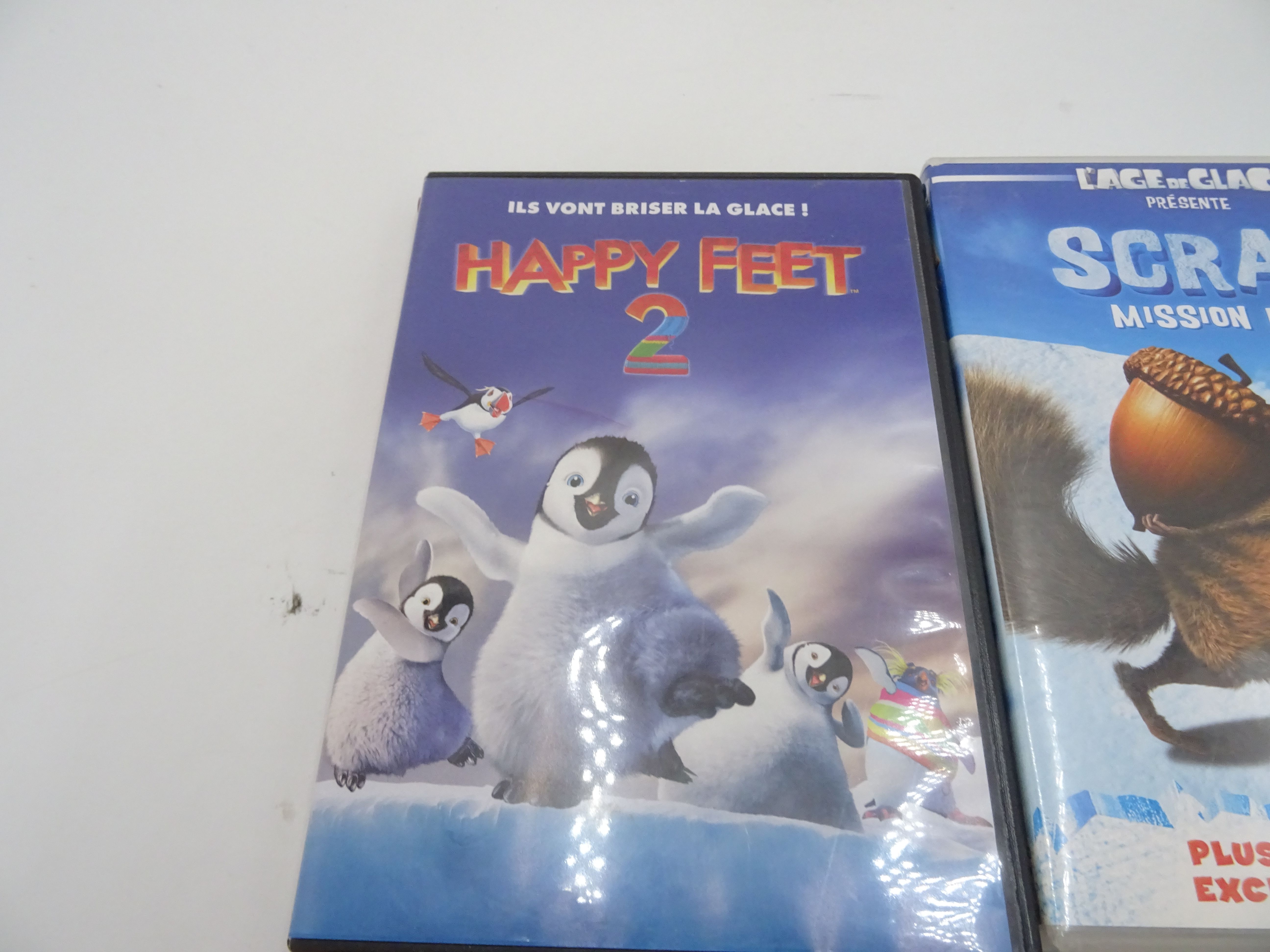 Voir photo 3 de Lot de 4 films jeunesse"Happy feet 2, Gang de requins, Les Pingouins, Scrat mission noix" Lot de 4 films jeunesse"Happy feet 2, Gang de requins, Les Pingouins, Scrat mission noix" Bon état reconditionné photo 3