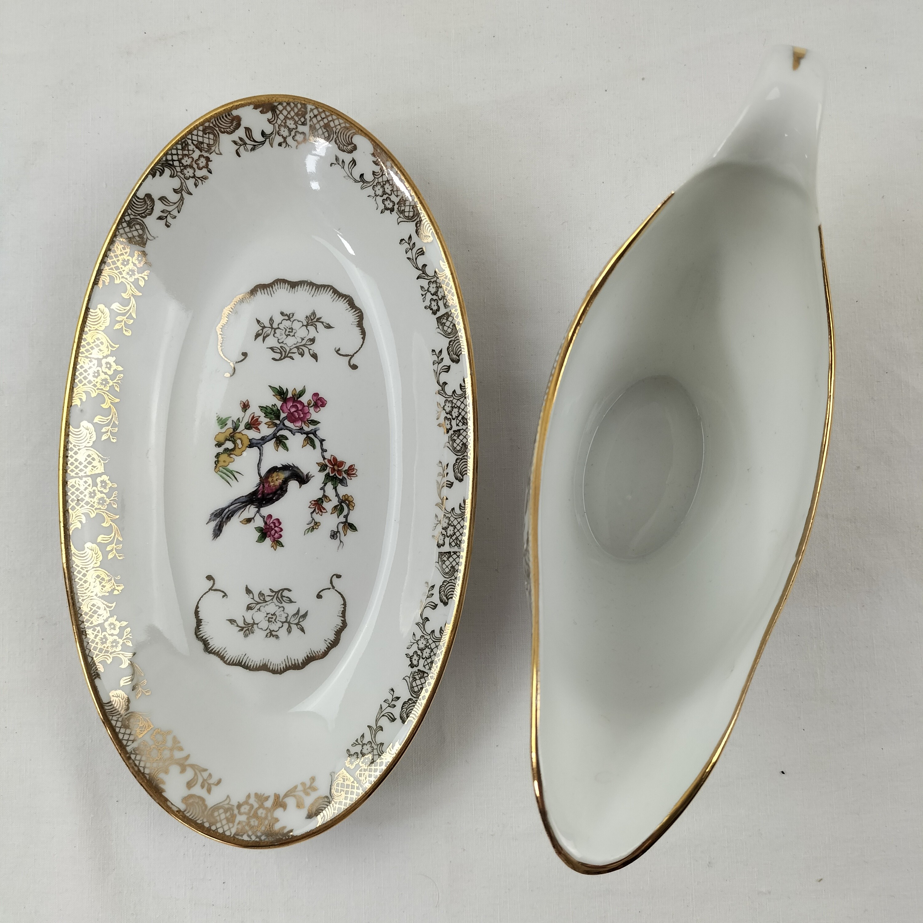 Voir photo 11 de Lot de plat ovale et saucière Oiseaux du Paradis "Porcelaine Véritable" Lot de plat ovale et saucière Oiseaux du Paradis "Porcelaine Véritable" Bon état reconditionné photo 11