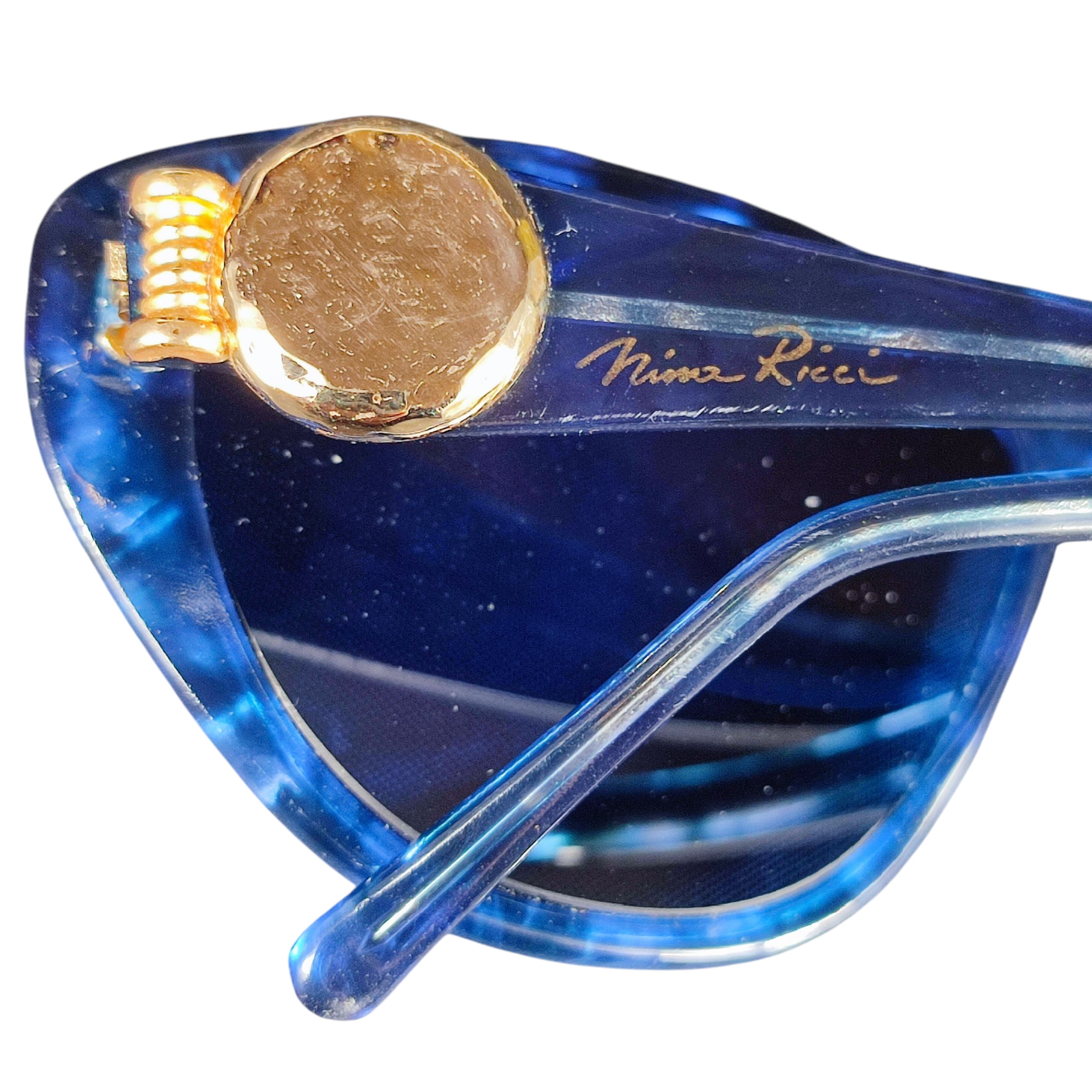 Voir photo 9 de Lunettes de soleil vintage Nina RICCI bleues pour femme Lunettes de soleil vintage Nina RICCI bleues pour femme État correct reconditionné photo 9