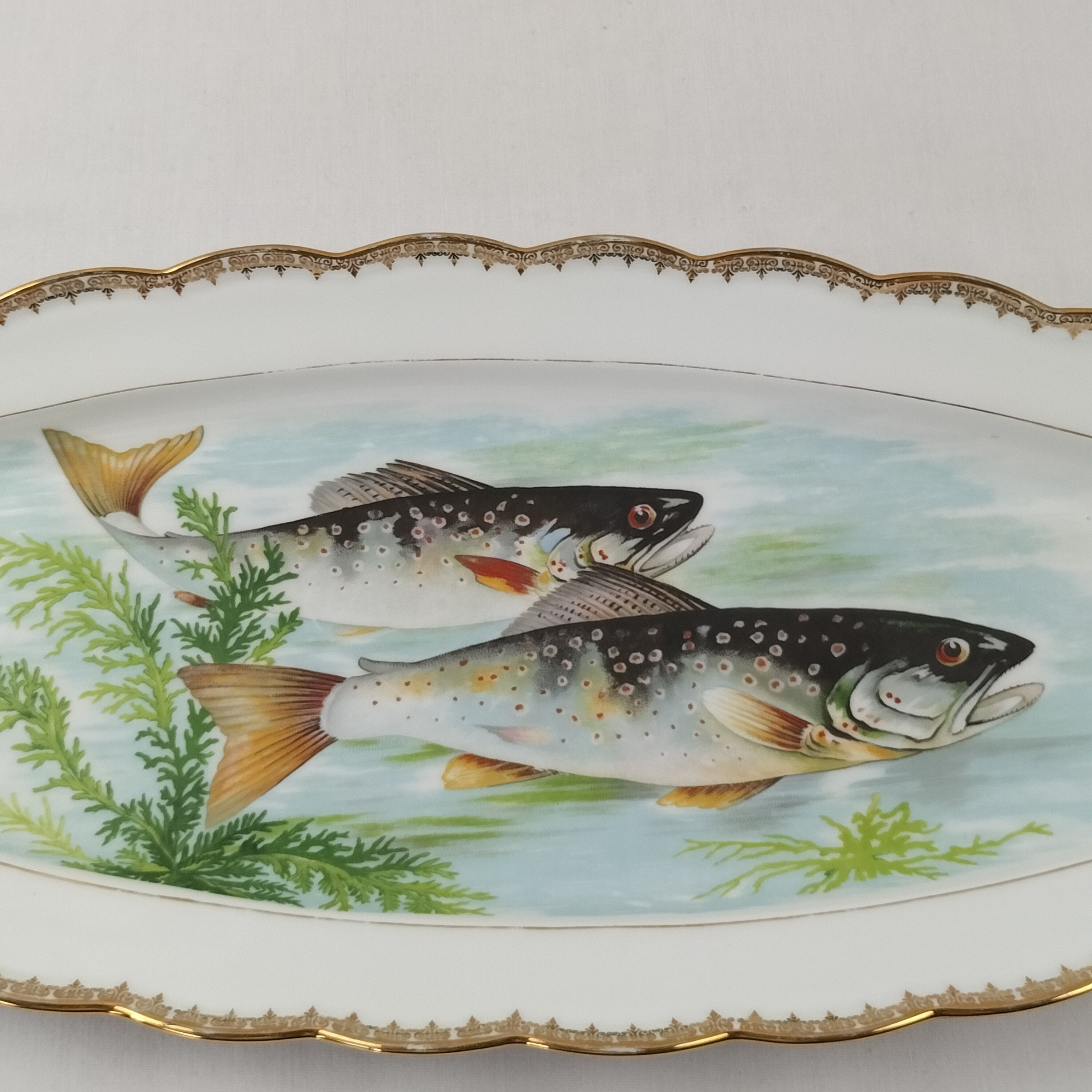 Voir photo 2 de Magnifique grand plat de service ovale "Poisson" en porcelaine lourde "Pommer Dureil" l'Etoile Porcelaine Magnifique grand plat de service ovale "Poisson" en porcelaine lourde "Pommer Dureil" l'Etoile Porcelaine Bon état reconditionné photo 2