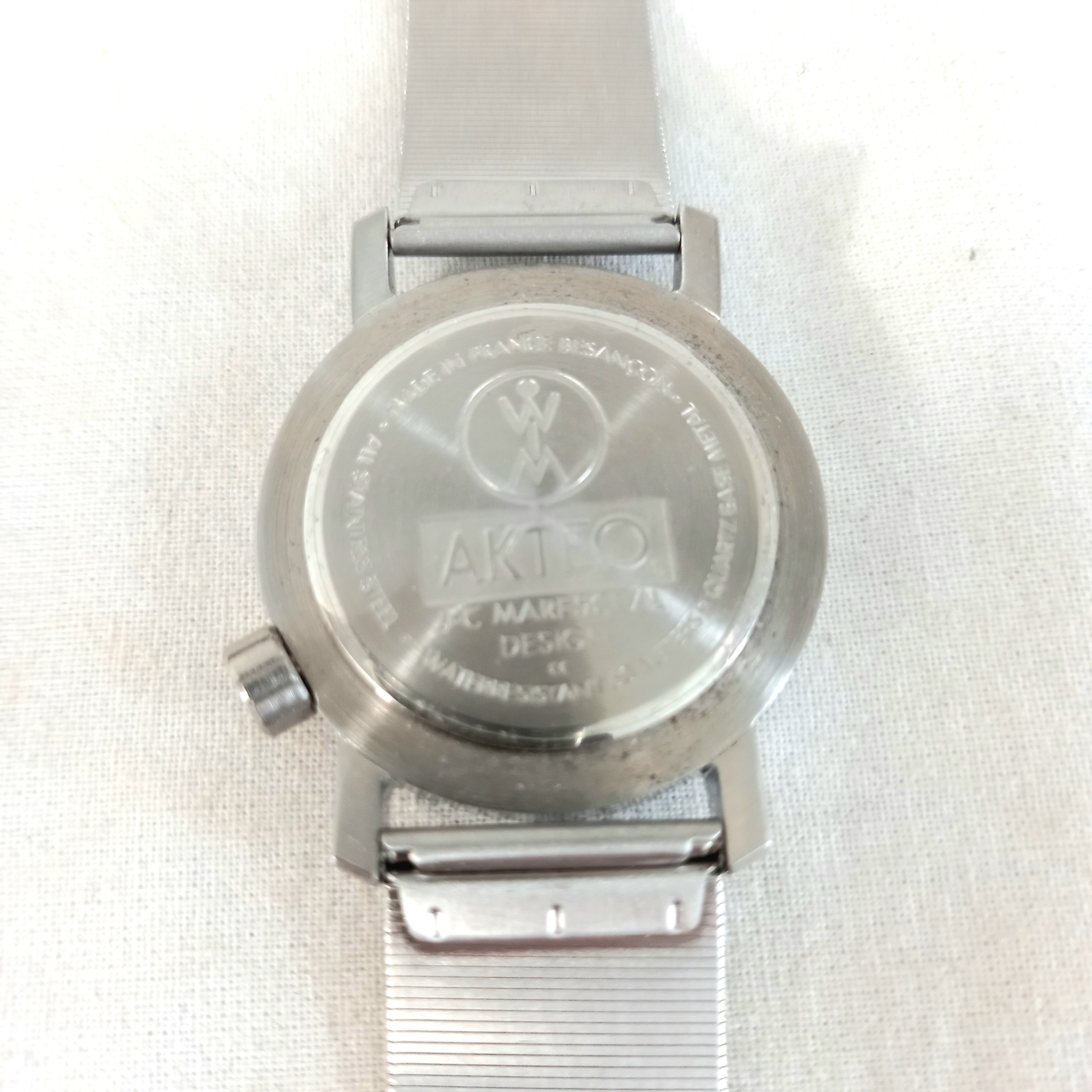 Voir photo 3 de Montre Aktéo, design Mareschal, bracelet maille acier, cadran montgolfière Montre Aktéo, design Mareschal, bracelet maille acier, cadran montgolfière Très bon état reconditionné photo 3