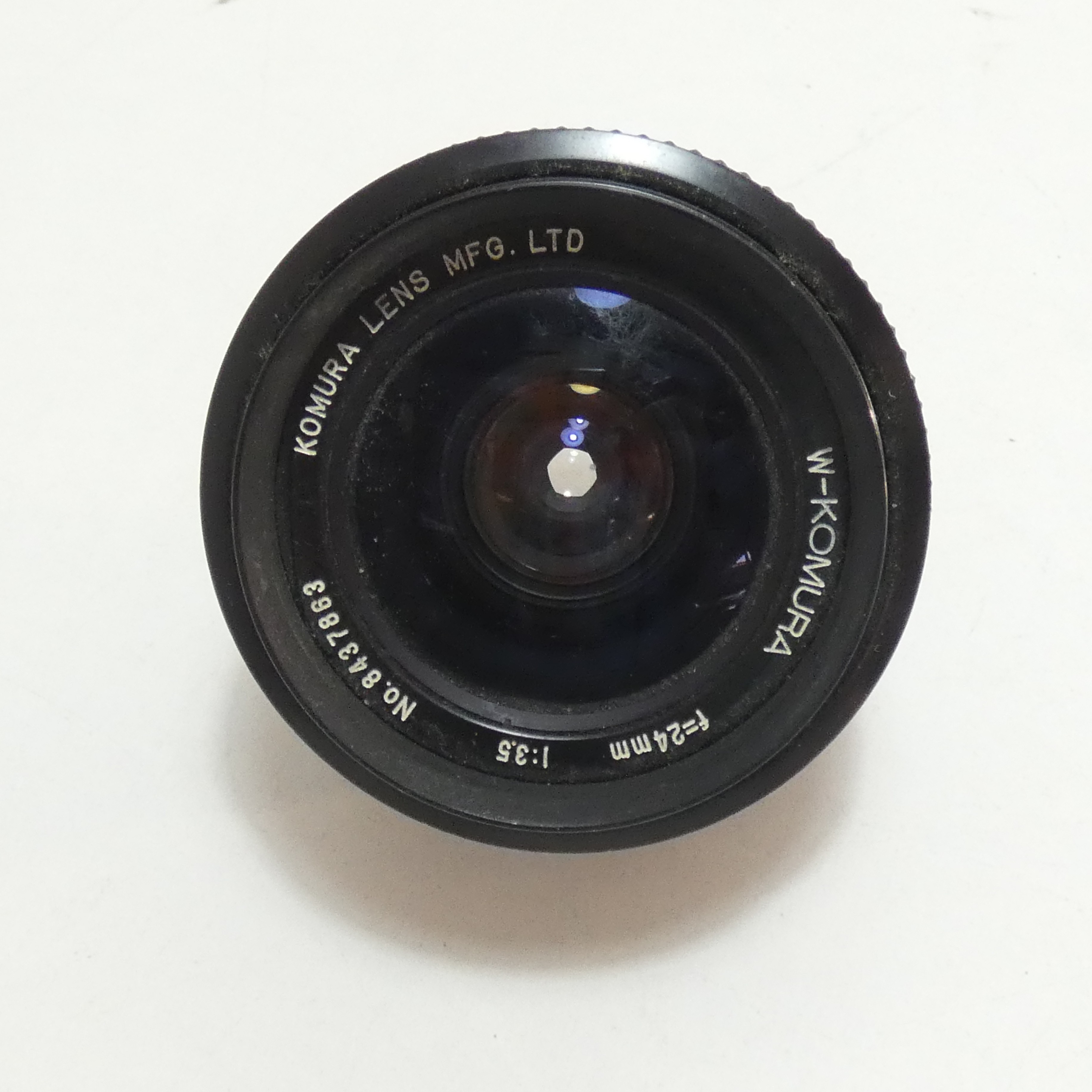 Voir photo 2 de Objectif KOMURA grand angle 24 mm Objectif KOMURA grand angle 24 mm Bon état reconditionné photo 2