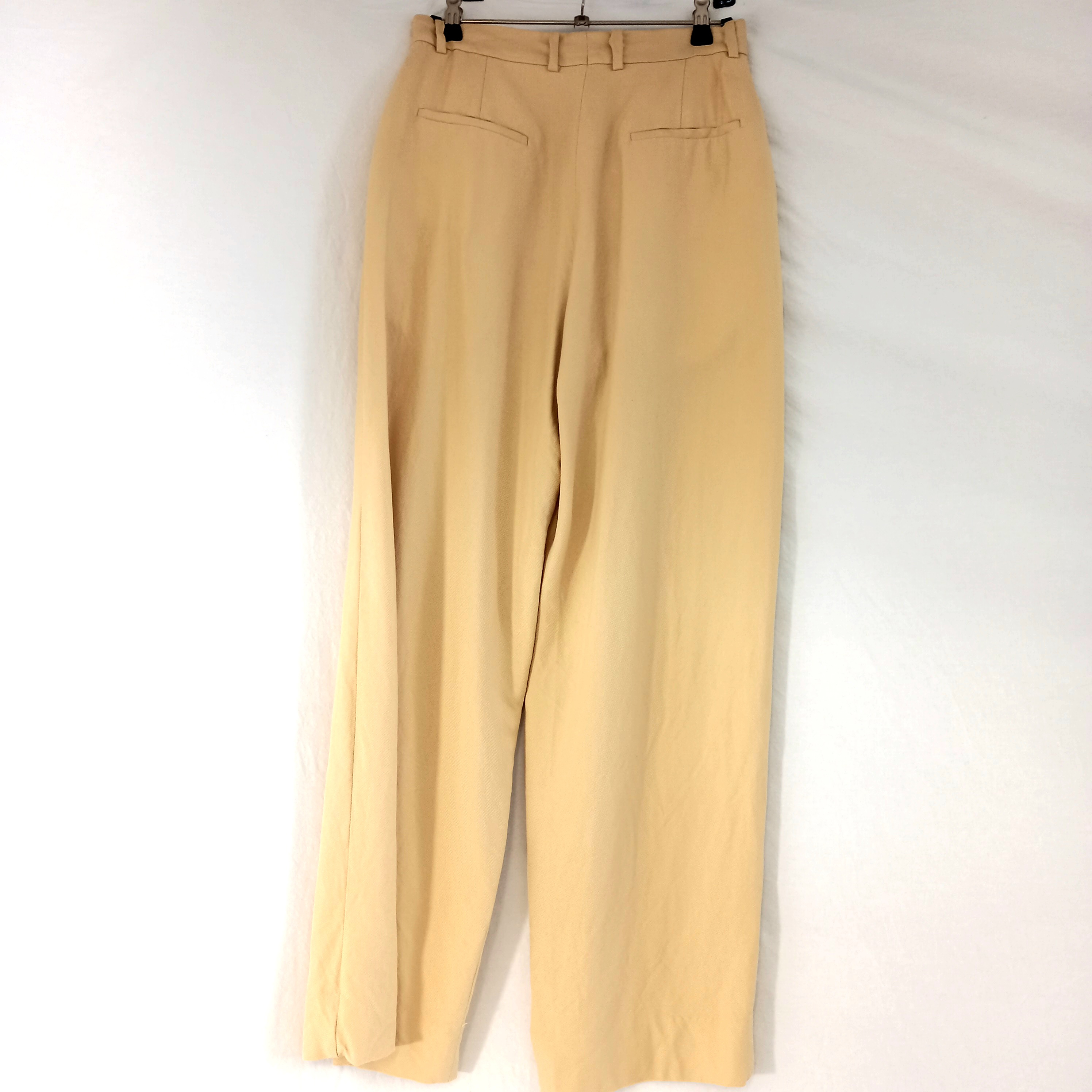 Voir photo 2 de Pantalon à pinces beige, de marque Sandro, en taille 36 Pantalon à pinces beige, de marque Sandro, en taille 36 Très bon état reconditionné photo 2
