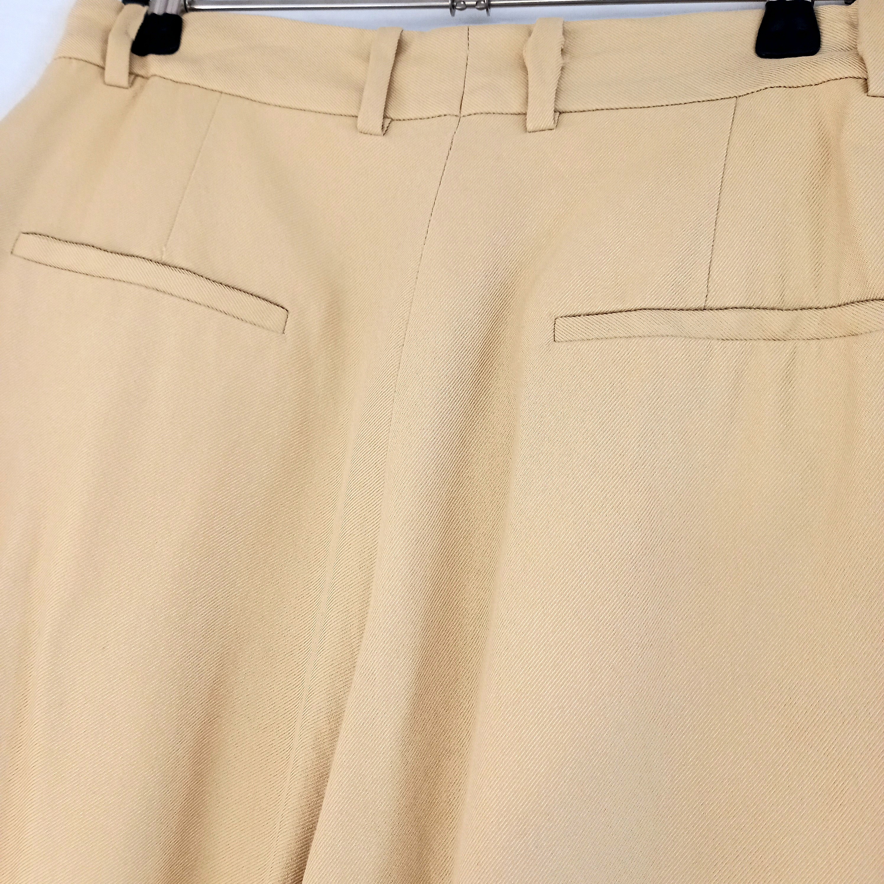 Voir photo 5 de Pantalon à pinces beige, de marque Sandro, en taille 36 Pantalon à pinces beige, de marque Sandro, en taille 36 Très bon état reconditionné photo 5