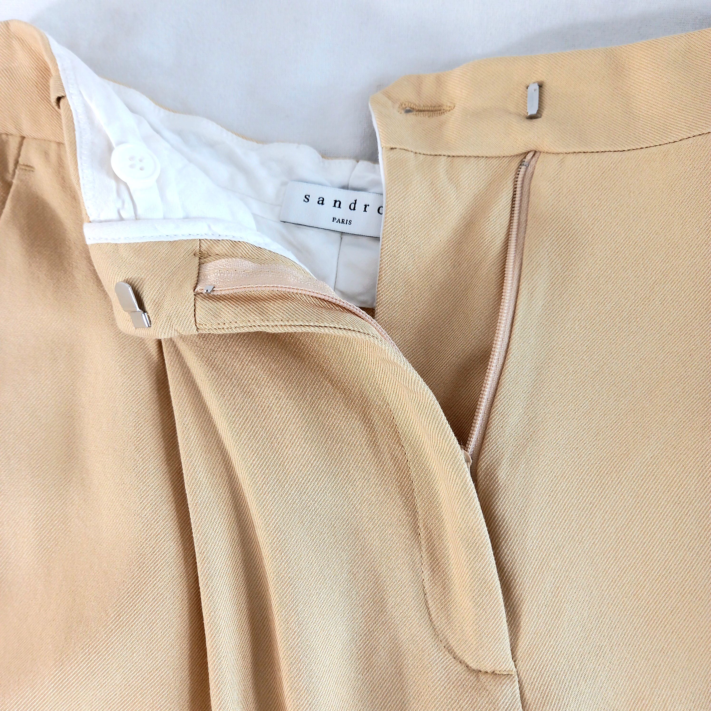 Voir photo 6 de Pantalon à pinces beige, de marque Sandro, en taille 36 Pantalon à pinces beige, de marque Sandro, en taille 36 Très bon état reconditionné photo 6