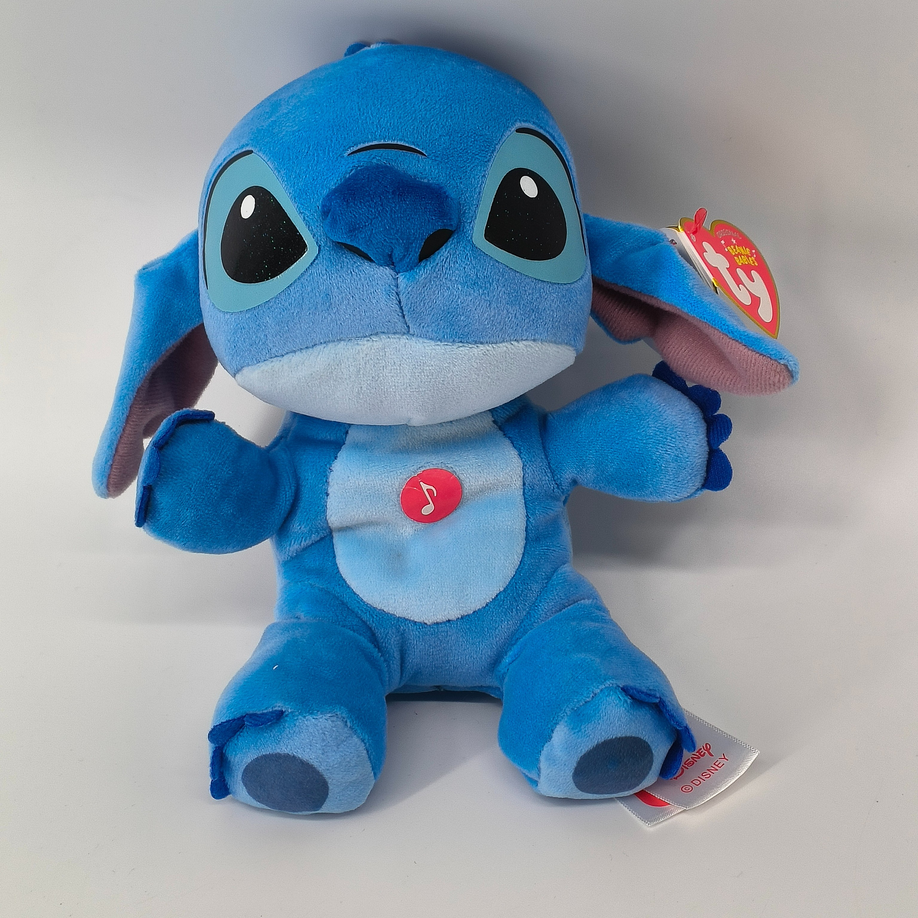 Voir photo 2 de Peluche musicale-Stitch-TY- à partir de 3 ans Peluche musicale-Stitch-TY- à partir de 3 ans Très bon état reconditionné photo 2