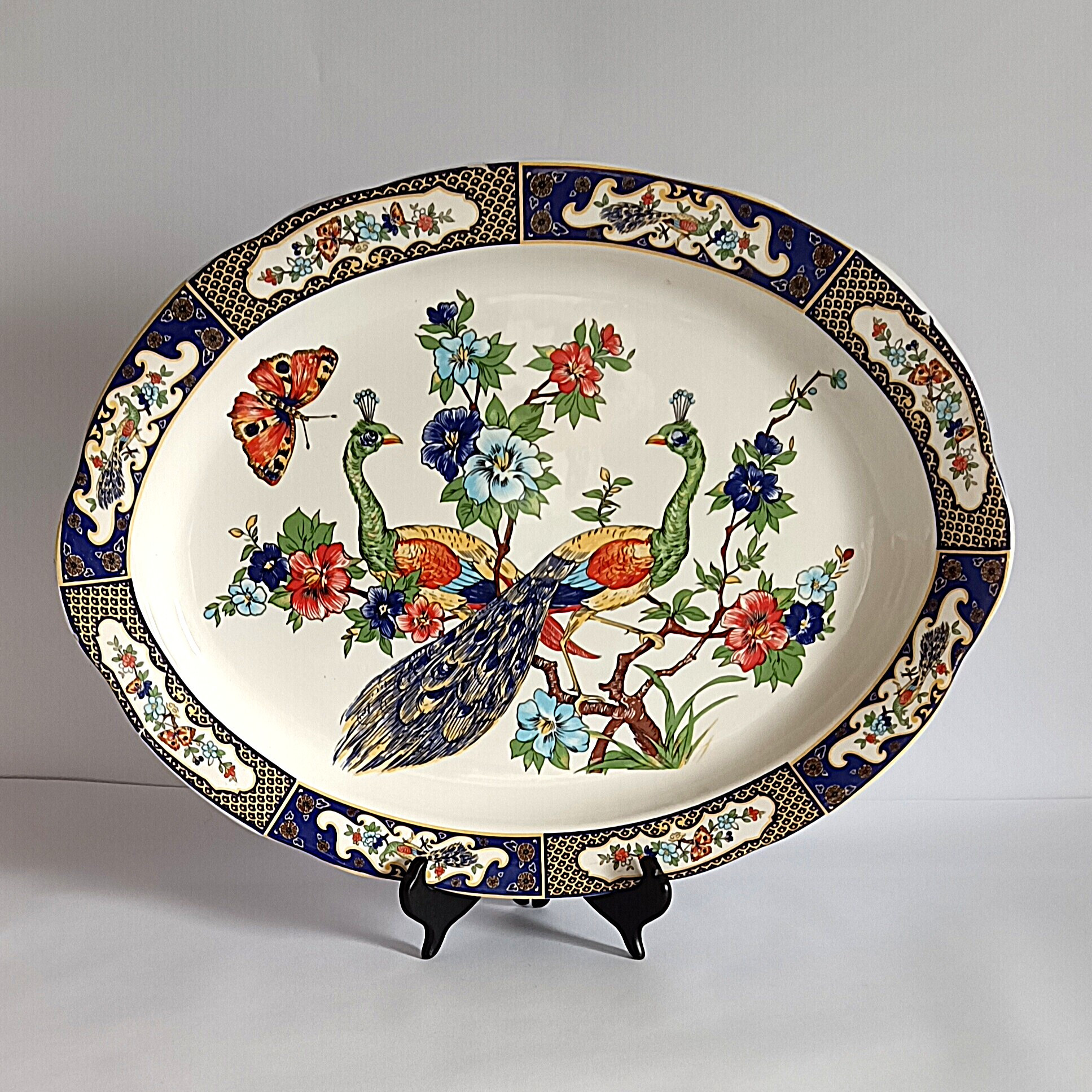 Voir photo 7 de Plat ovale en faïence décor paons et fleurs – 47,5 x 35,5 cm Plat ovale en faïence décor paons et fleurs – 47,5 x 35,5 cm Bon état reconditionné photo 7