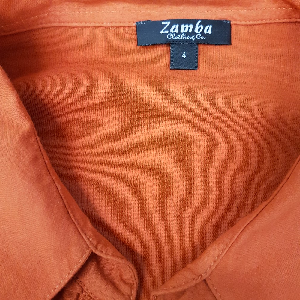 Voir photo 6 de Polo orange bi-matière - ZAMBA - Taille 4 Polo orange bi-matière - ZAMBA - Taille 4 Très bon état reconditionné photo 6