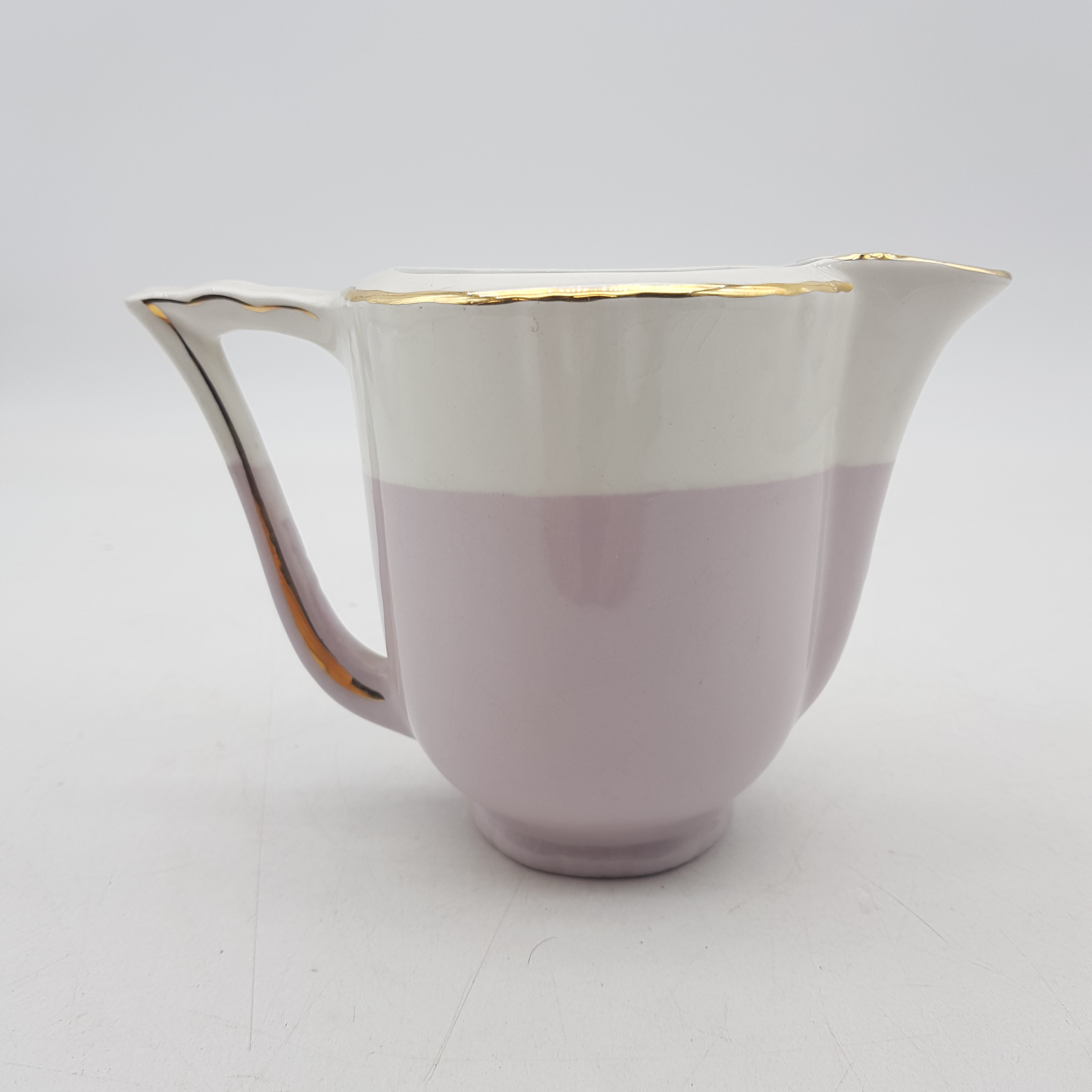 Voir photo 2 de Pot à lait-décor cygnes- rose/beige-liseré or "Moulin des loups" Pot à lait-décor cygnes- rose/beige-liseré or "Moulin des loups" Bon état reconditionné photo 2