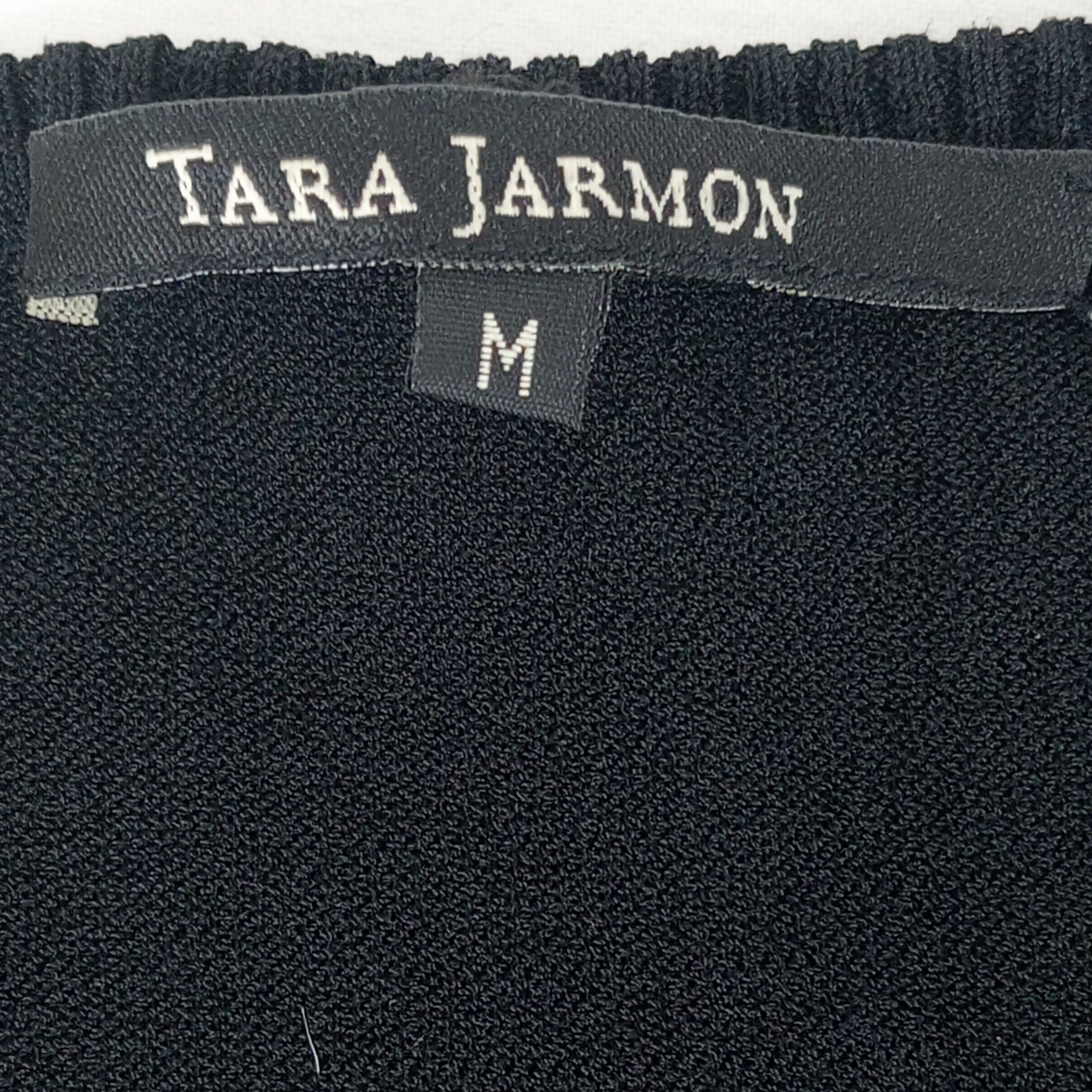 Voir photo 4 de Pull - femme - marque Tara Jarmon - manches courtes - couleur noir - taille M (38) Pull - femme - marque Tara Jarmon - manches courtes - couleur noir - taille M (38) Très bon état reconditionné photo 4