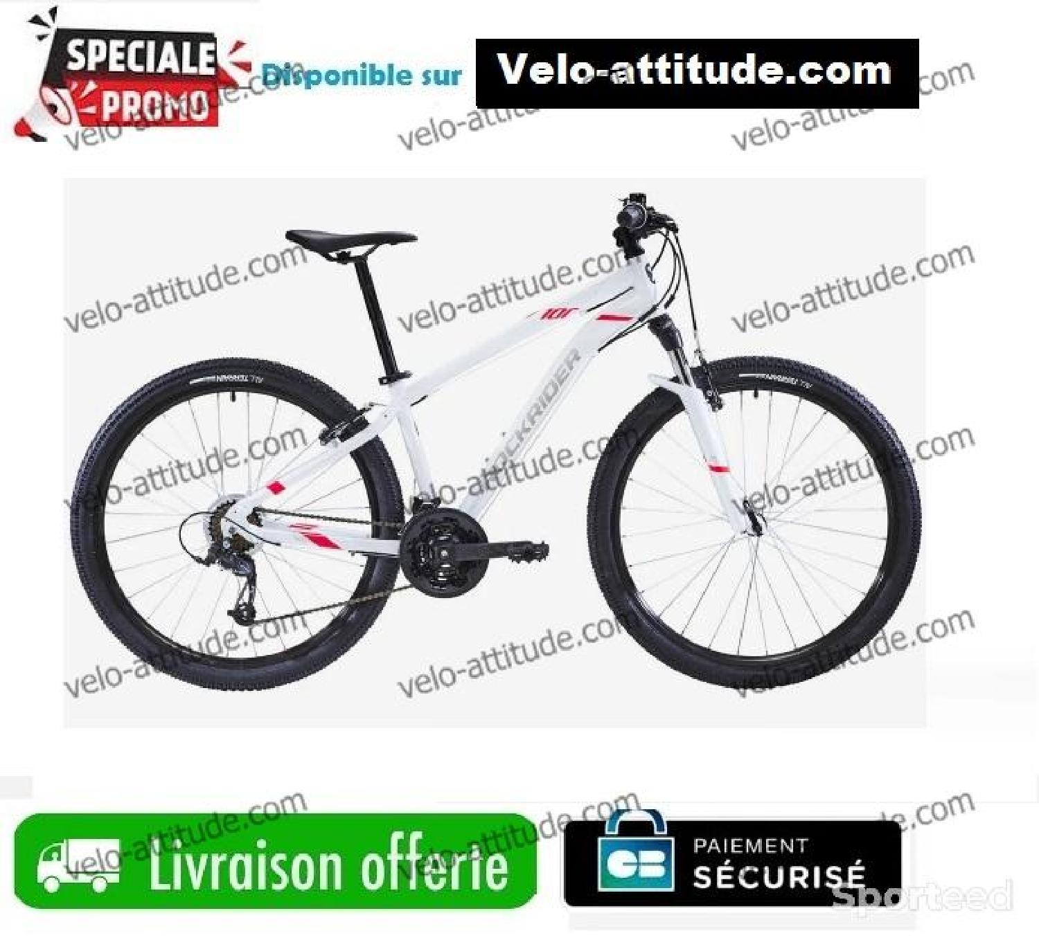 ROCKRIDER VÉLO VTT ST 100 FEMME BLANC ROSE 27,5 Comme neuf (c'est déjà la condition standard) Rockrider reconditionné disponible sur Sporteed