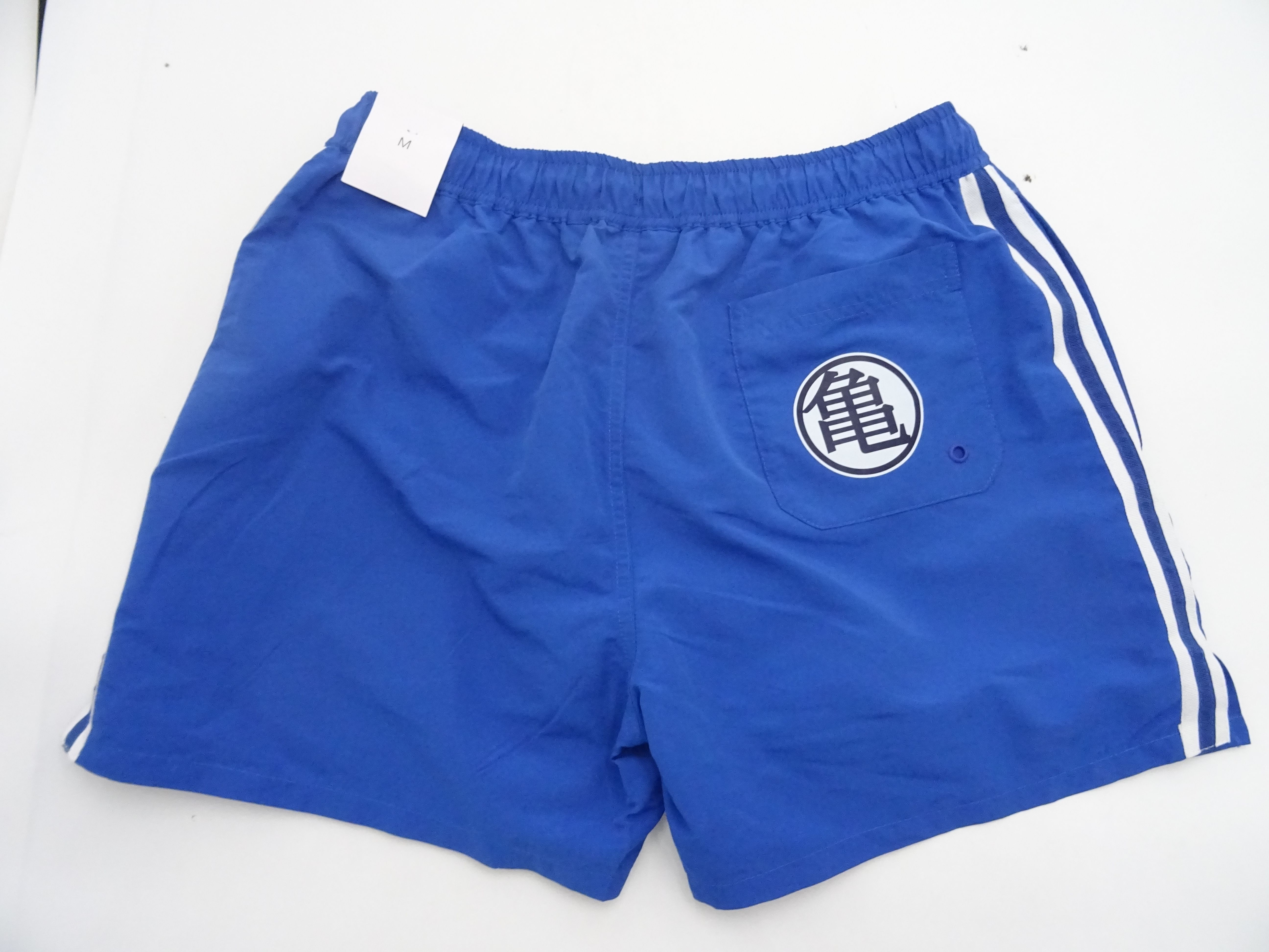 Voir photo 2 de Short de bain bleu Célio "Dragon Ball- Tortue Géniale" taille XS Short de bain bleu Célio "Dragon Ball- Tortue Géniale" taille XS Parfait état reconditionné photo 2