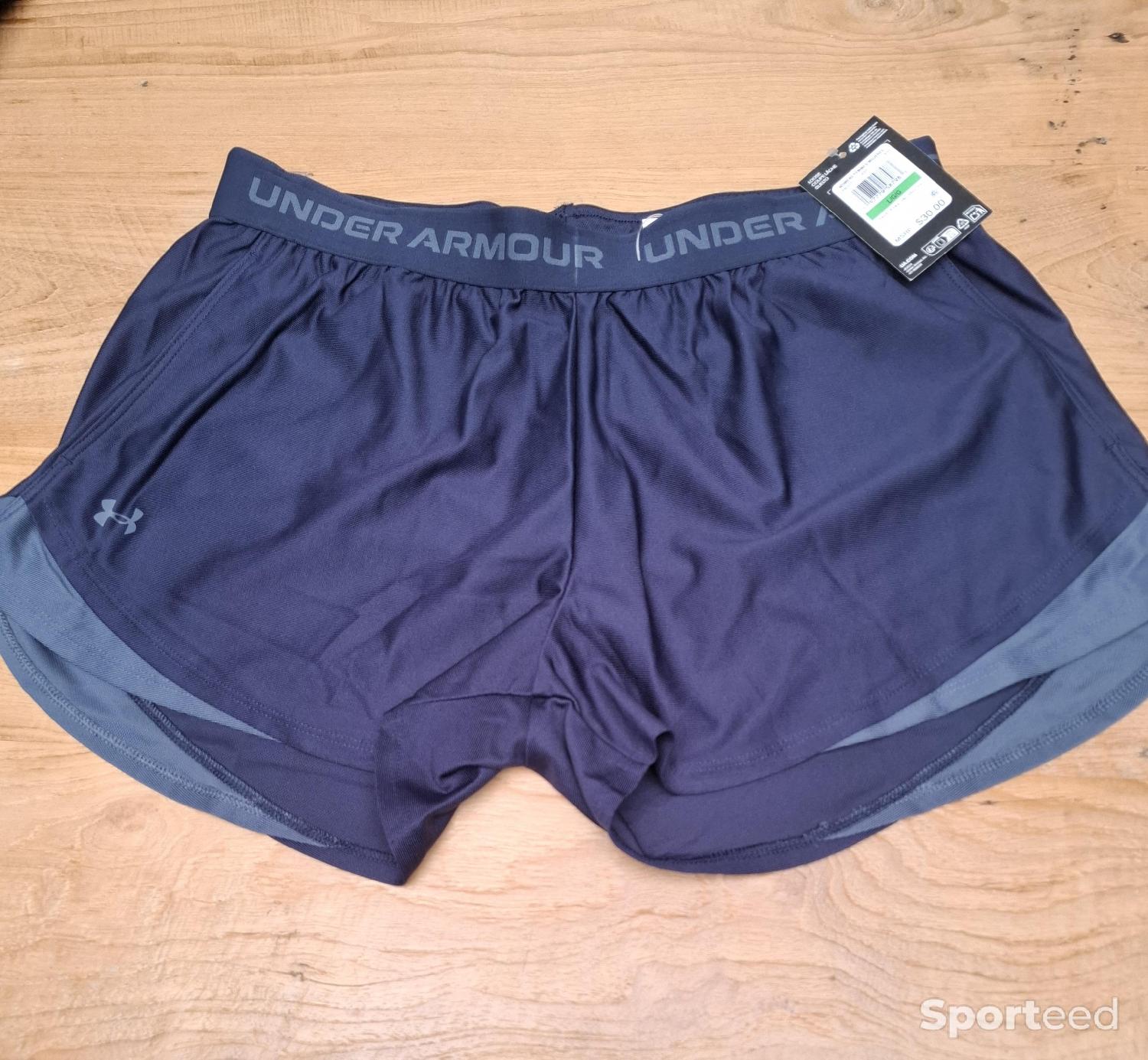 Short de course à pied Comme neuf (c'est déjà la condition standard) Under Armour reconditionné disponible sur Sporteed