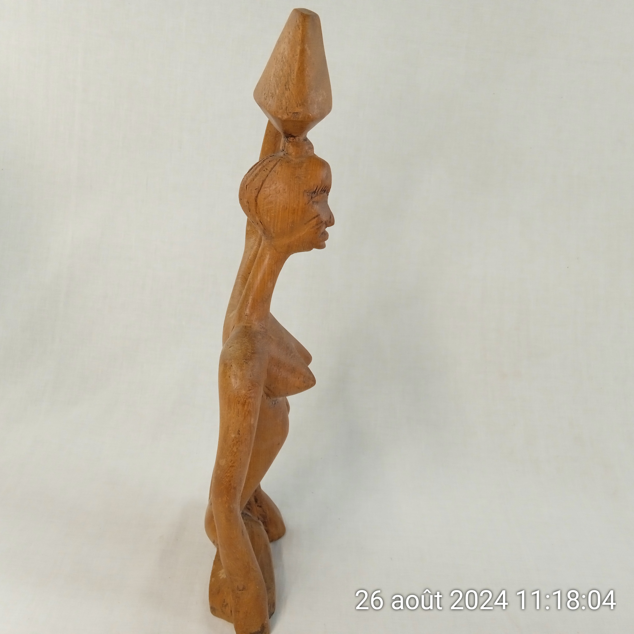 Voir photo 6 de Statuette africaine femme porteuse en bois sculpté 45 cm Statuette africaine femme porteuse en bois sculpté 45 cm Bon état reconditionné photo 6