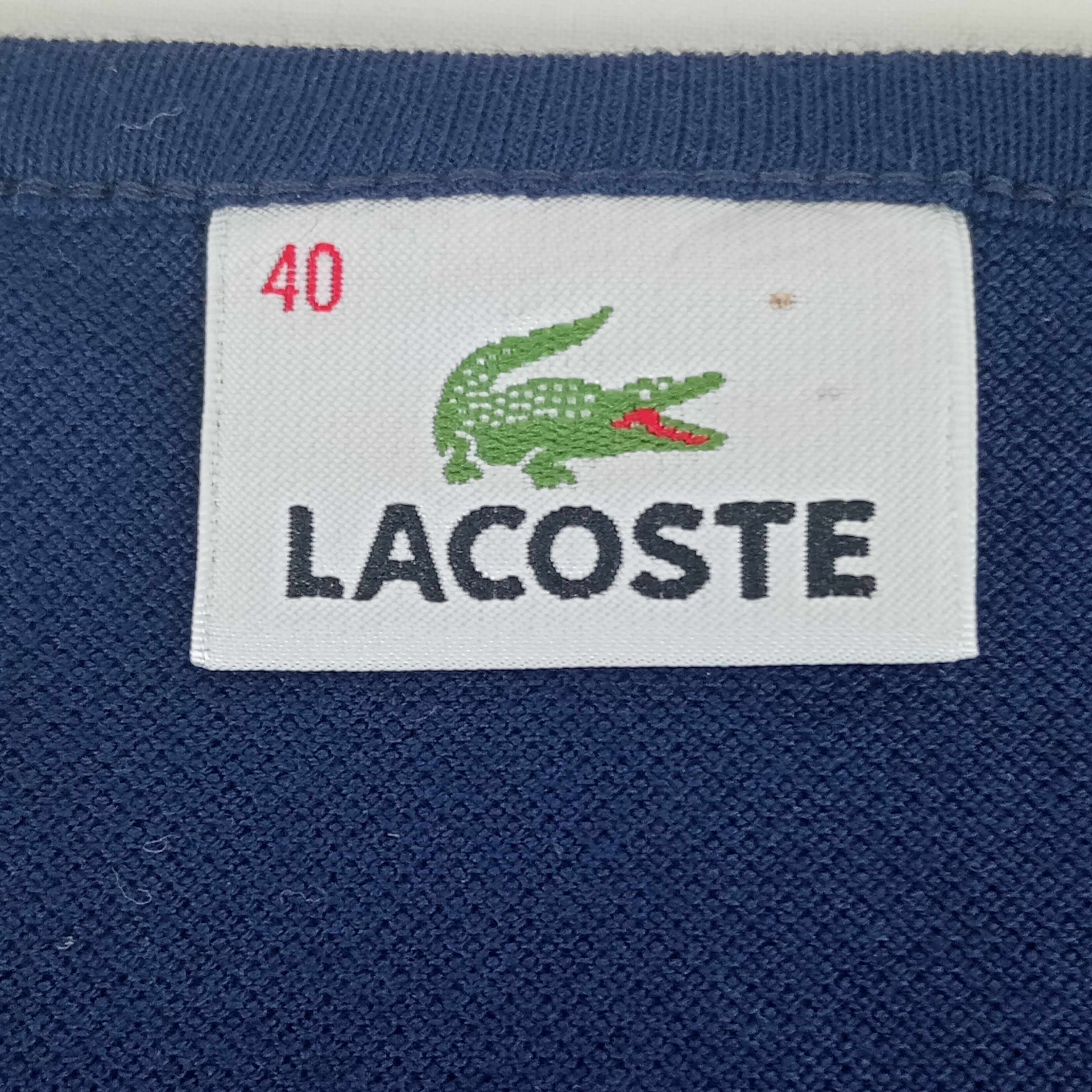 Voir photo 7 de T shirt - femme - marque Lacoste - manches courtes - couleur bleu marine - taille L (40) T shirt - femme - marque Lacoste - manches courtes - couleur bleu marine - taille L (40) Très bon état reconditionné photo 7