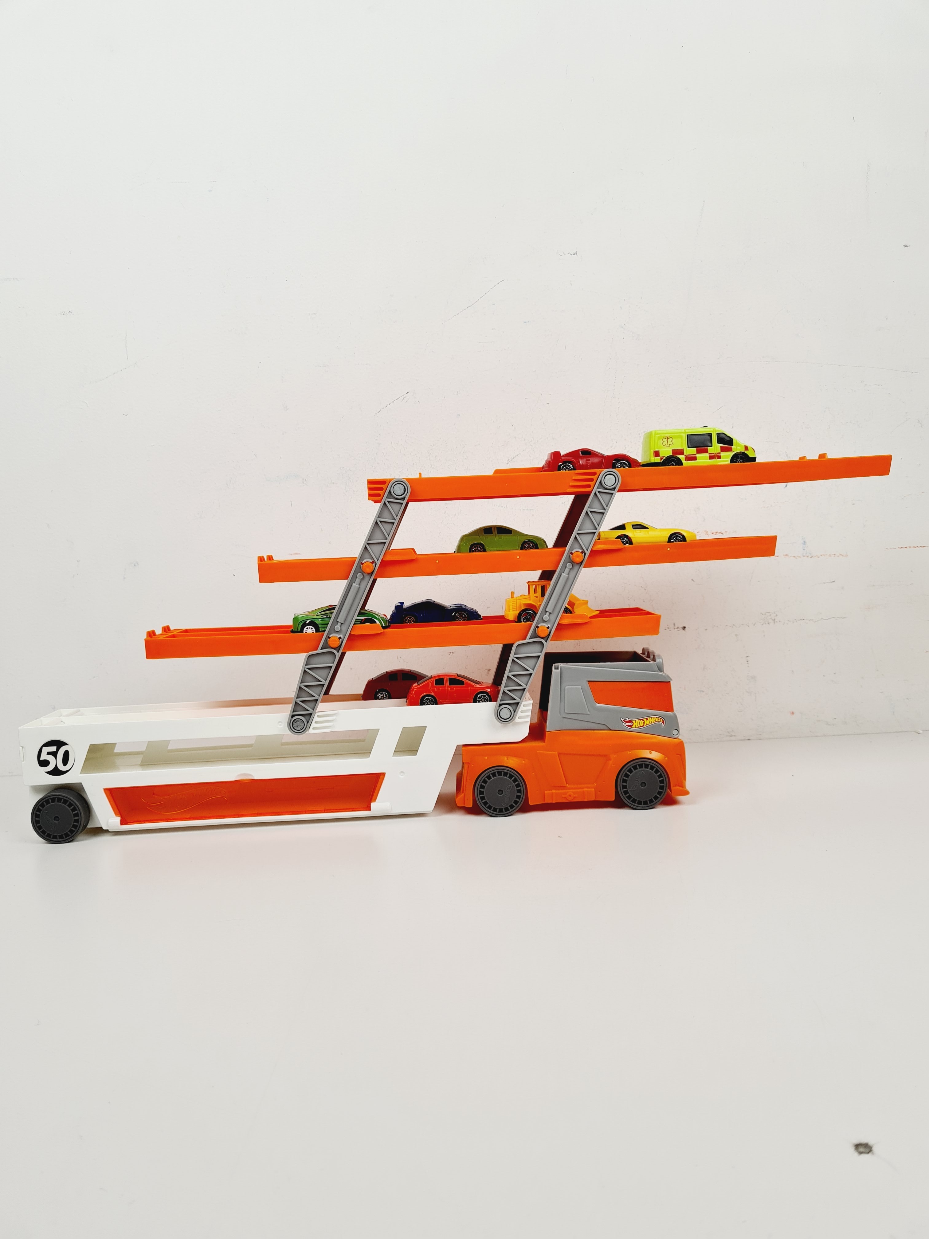 Voir photo 5 de Voiture - Camion Méga Transporteur, avec lot de 10 petites voitures - Hot wheels - 45 cm Voiture - Camion Méga Transporteur, avec lot de 10 petites voitures - Hot wheels - 45 cm Bon état reconditionné photo 5