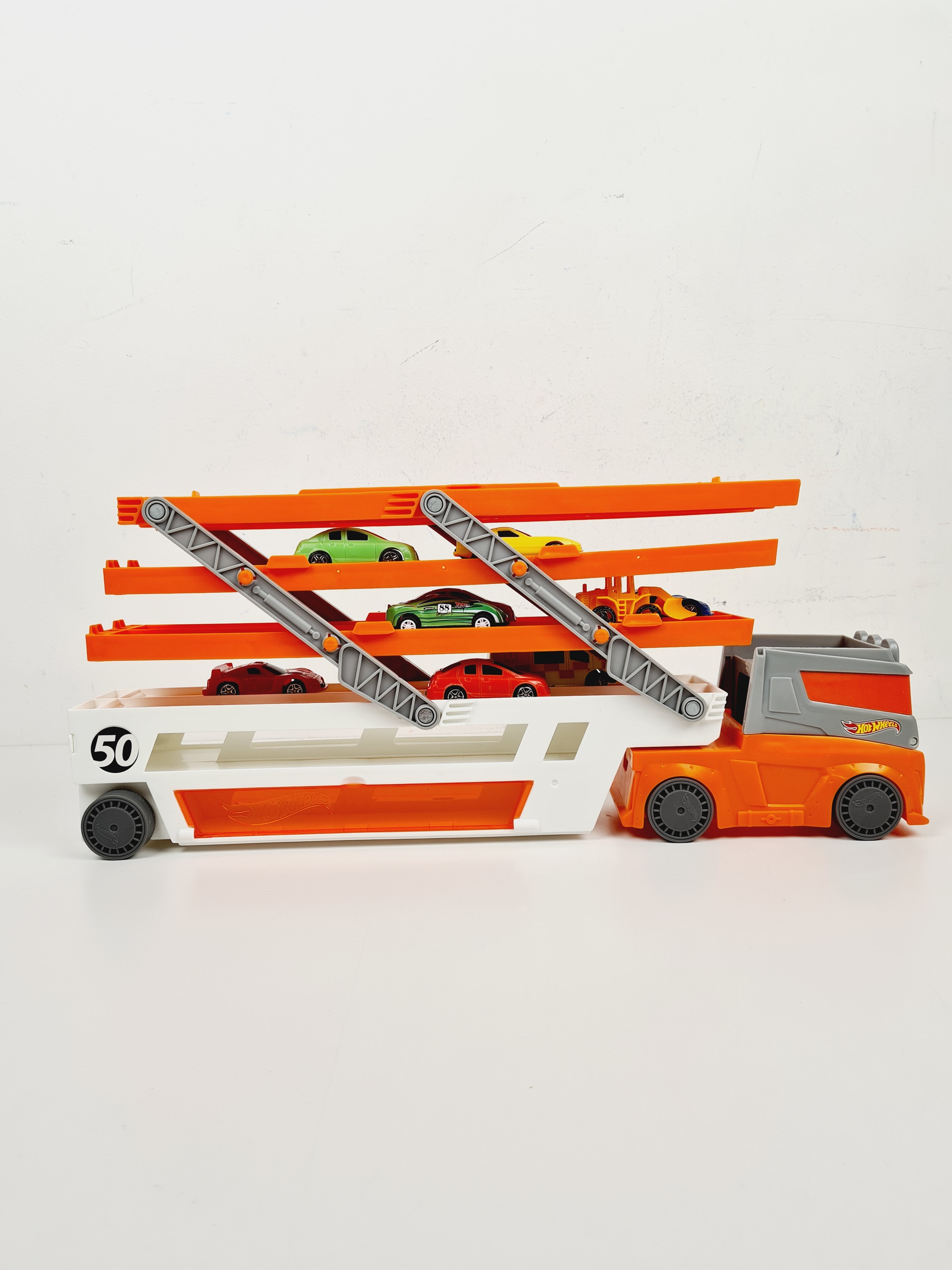 Voir photo 8 de Voiture - Camion Méga Transporteur, avec lot de 10 petites voitures - Hot wheels - 45 cm Voiture - Camion Méga Transporteur, avec lot de 10 petites voitures - Hot wheels - 45 cm Bon état reconditionné photo 8