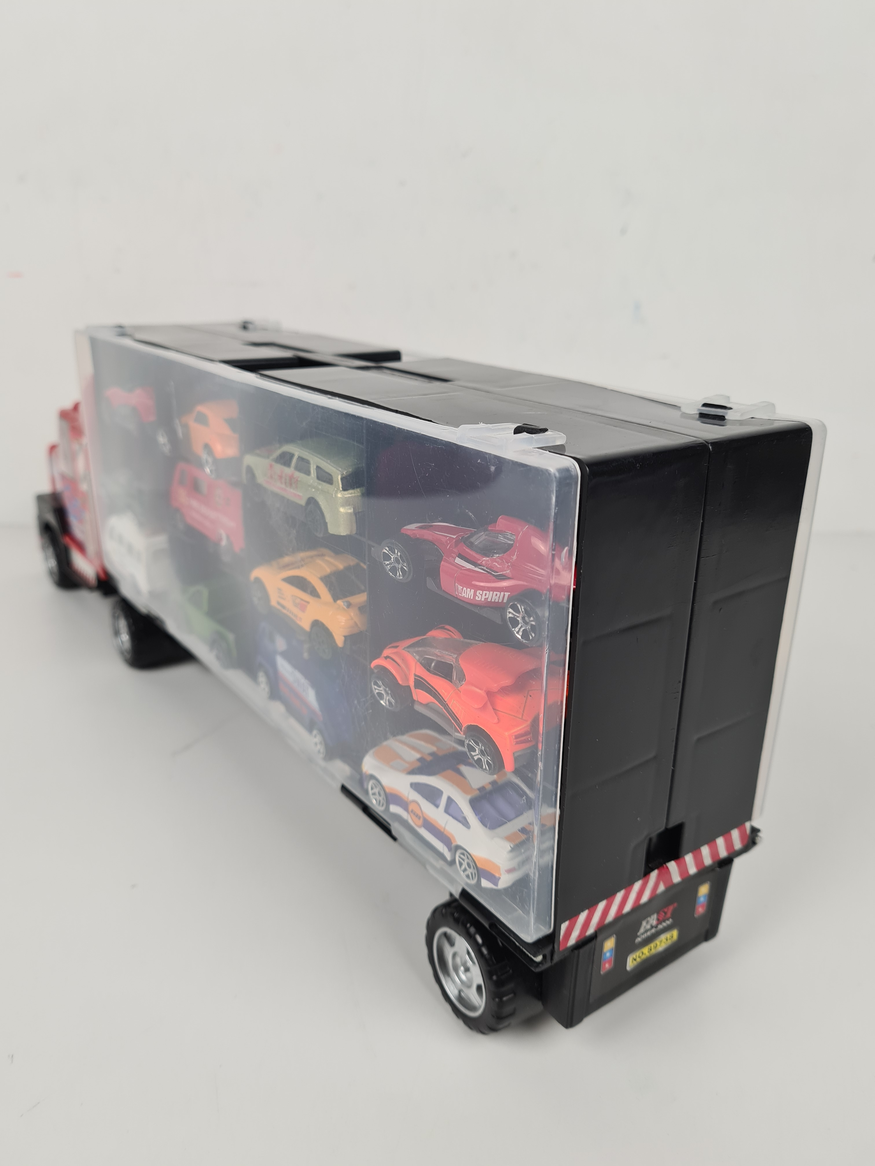 Voir photo 4 de Voiture - Camion transportant des voitures et 24 petites voitures ( Heavy Duty transporter) - 49 x 17 x 9 cm. Voiture - Camion transportant des voitures et 24 petites voitures ( Heavy Duty transporter) - 49 x 17 x 9 cm. Bon état reconditionné photo 4
