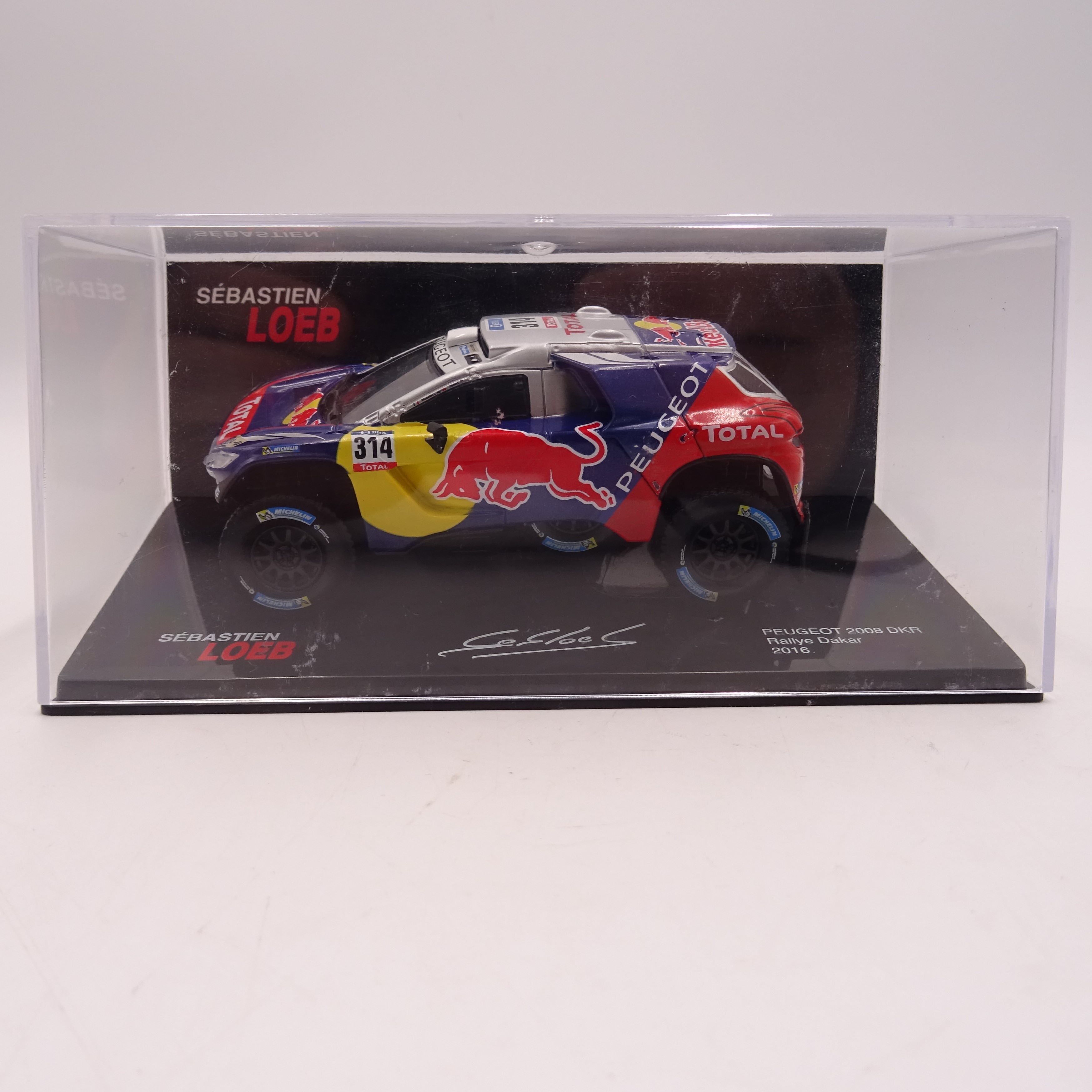 Voir photo 3 de Voiture miniature de Sébastien Loeb - Peugeot 2008 Dakar 2016 Voiture miniature de Sébastien Loeb - Peugeot 2008 Dakar 2016 Bon état reconditionné photo 3